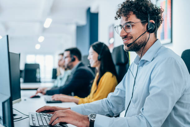 Man with a headset working at a computer