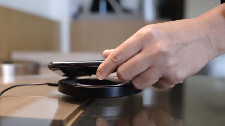 Smartphone placed on a wireless charging pad