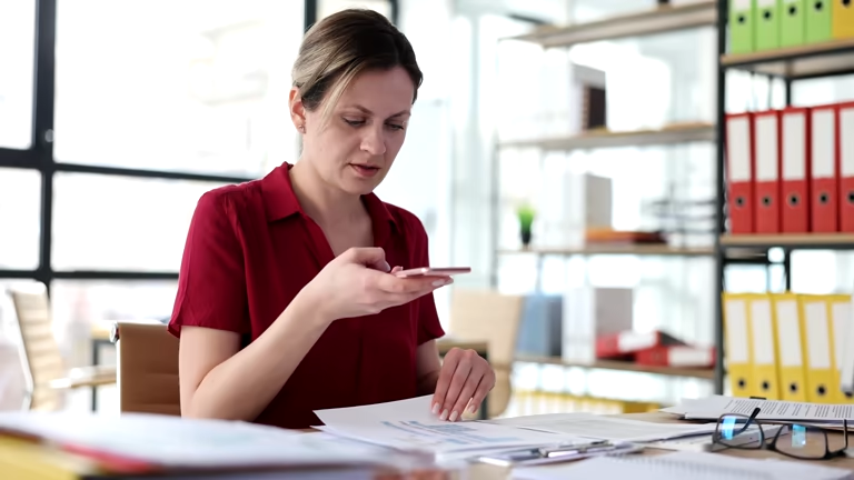 Woman checking timesheet on phone