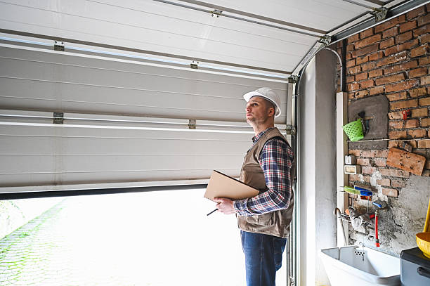 Worker with clipboard standing in garage door