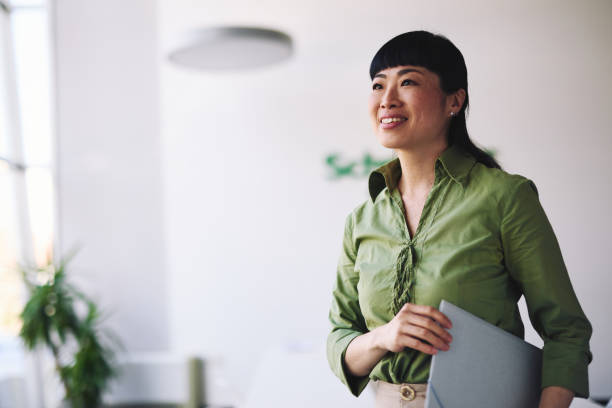 Woman holding a tablet in an office environment