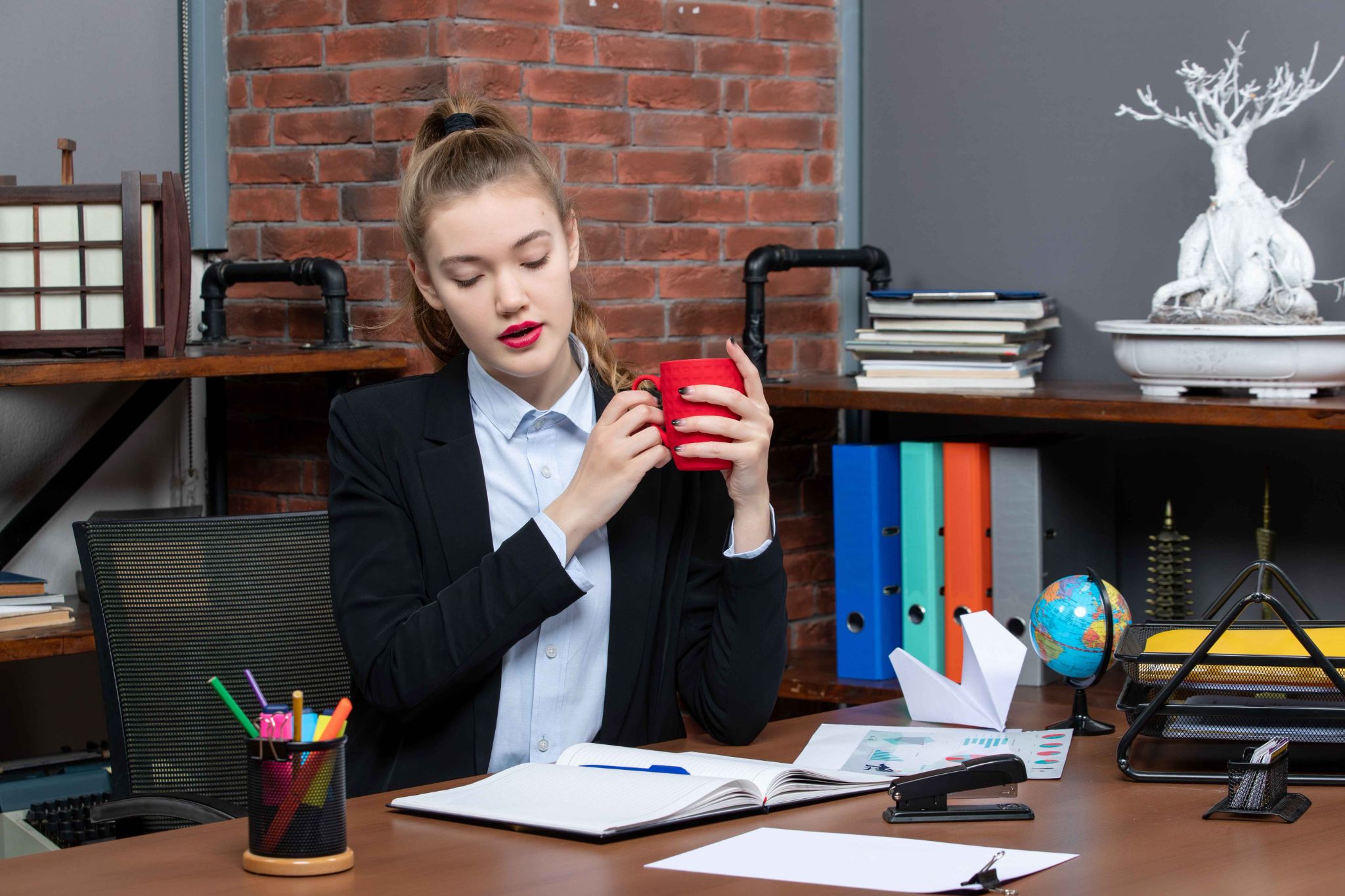 Office employee with work log showing accountability