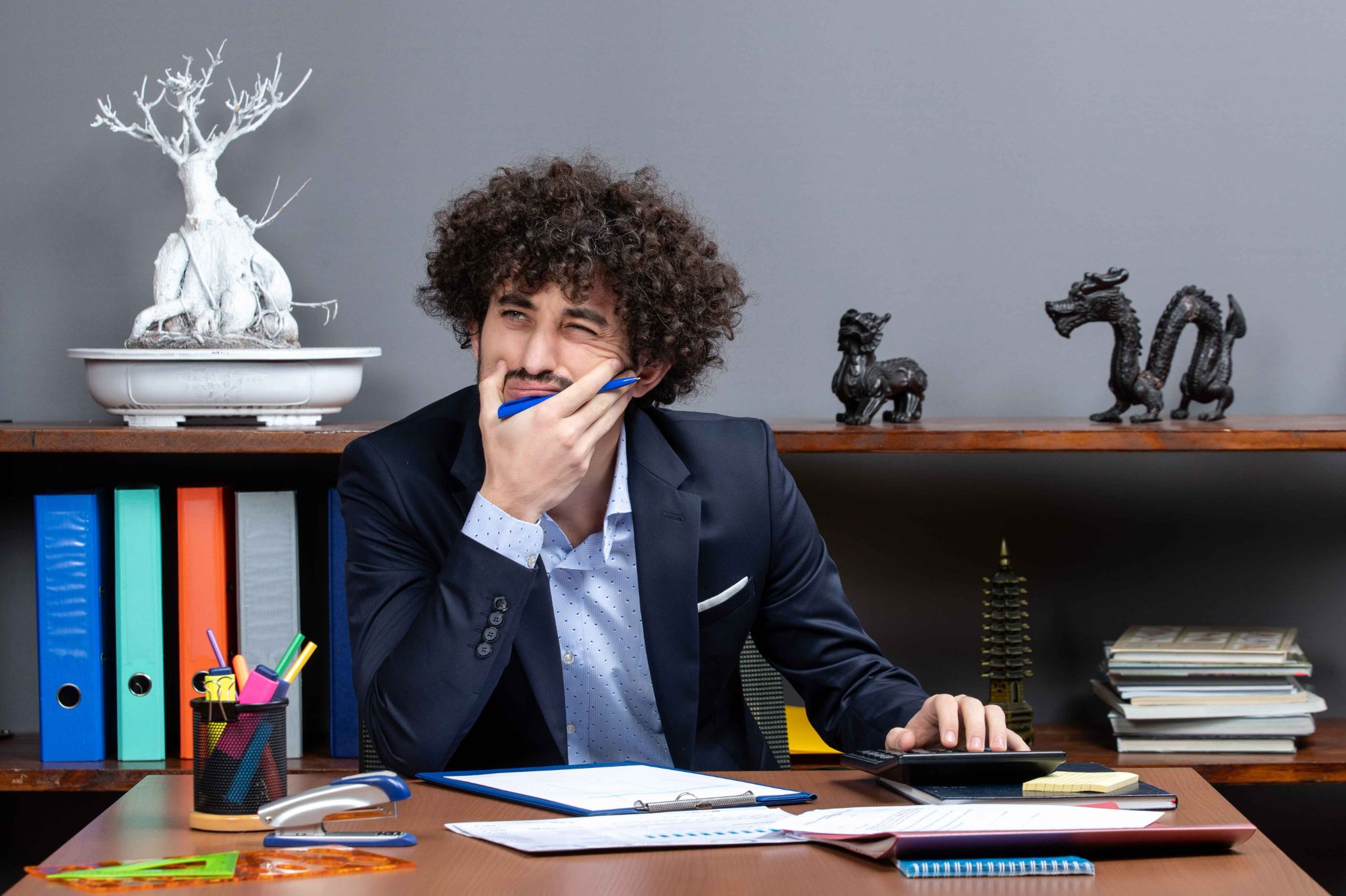 Employee reviewing daily work log data at a desk