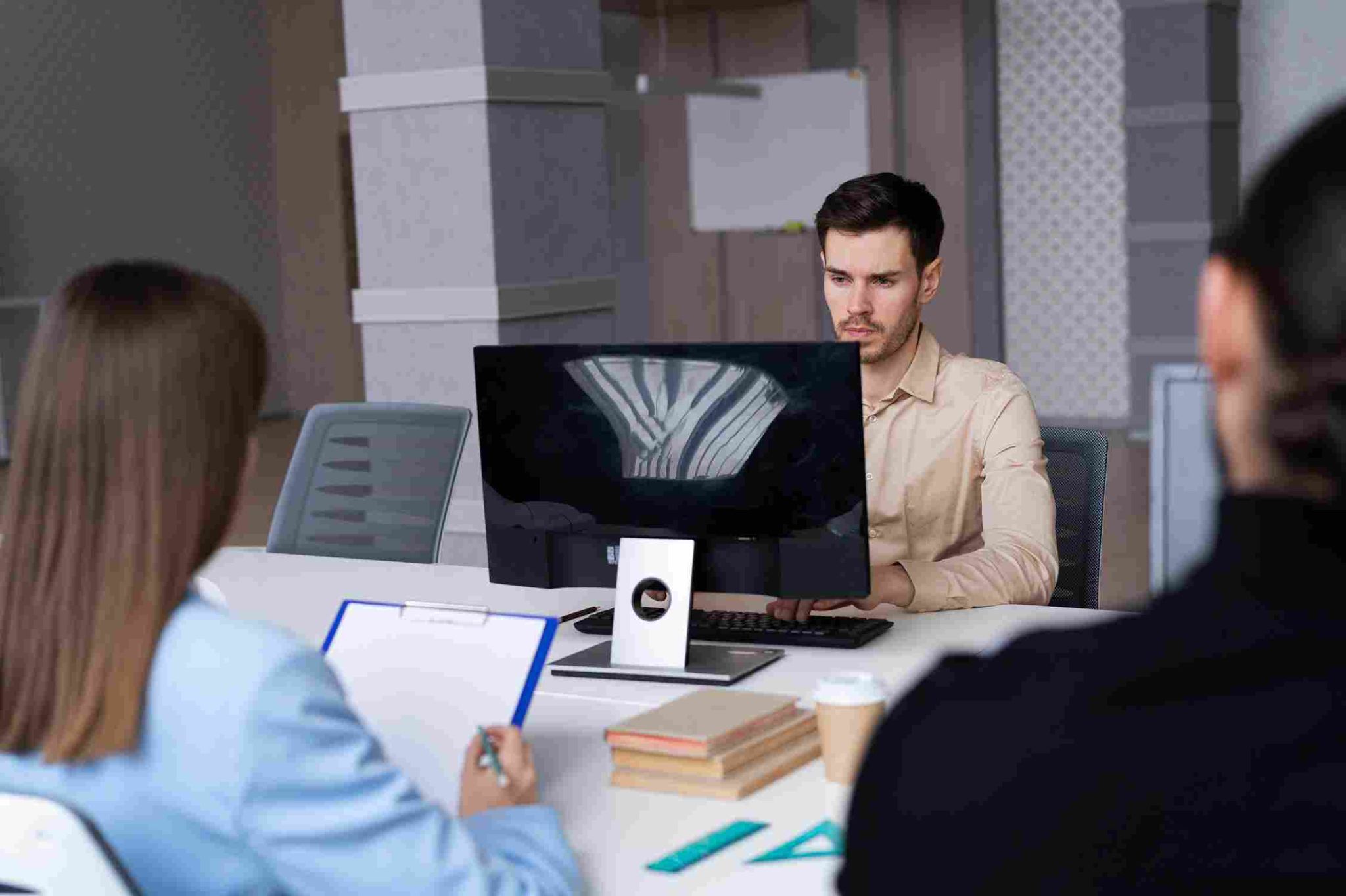 Employees working at their desks with real-time tracking
