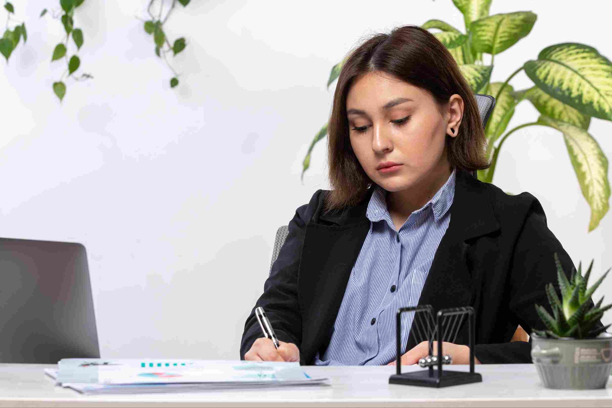 A woman focused on her work at a desk