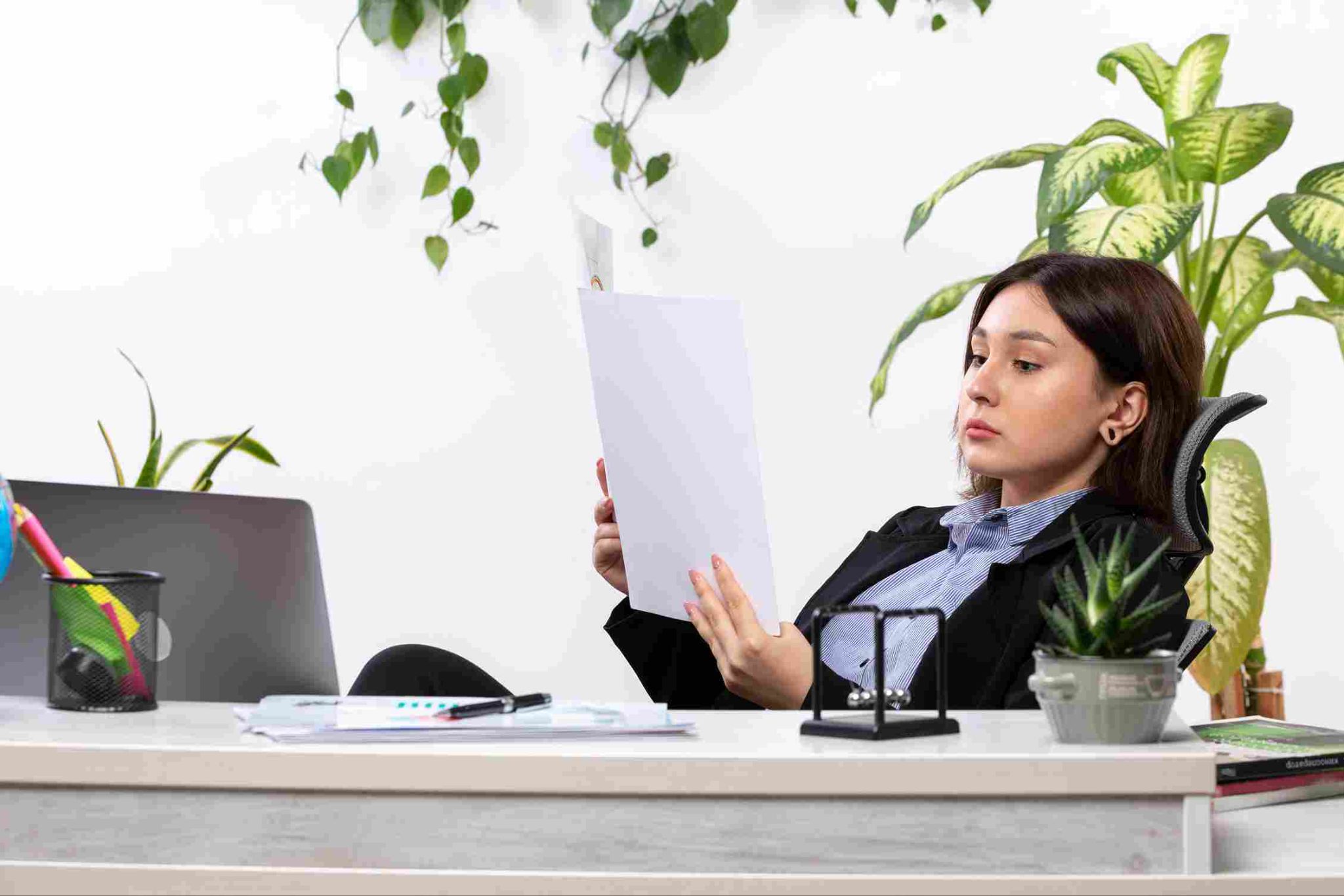 Employee looking at document at desk