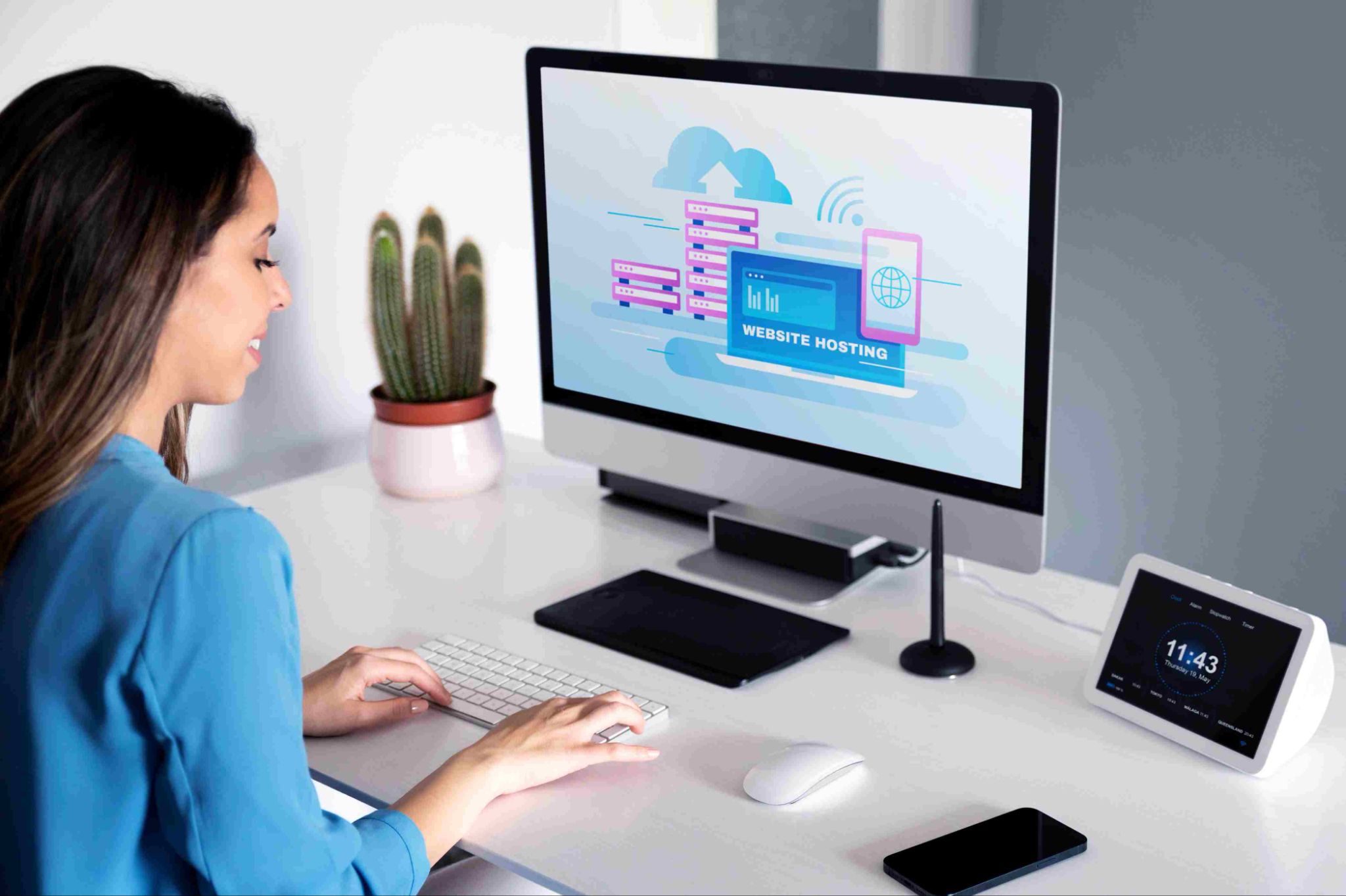 Woman working on computer and tablet