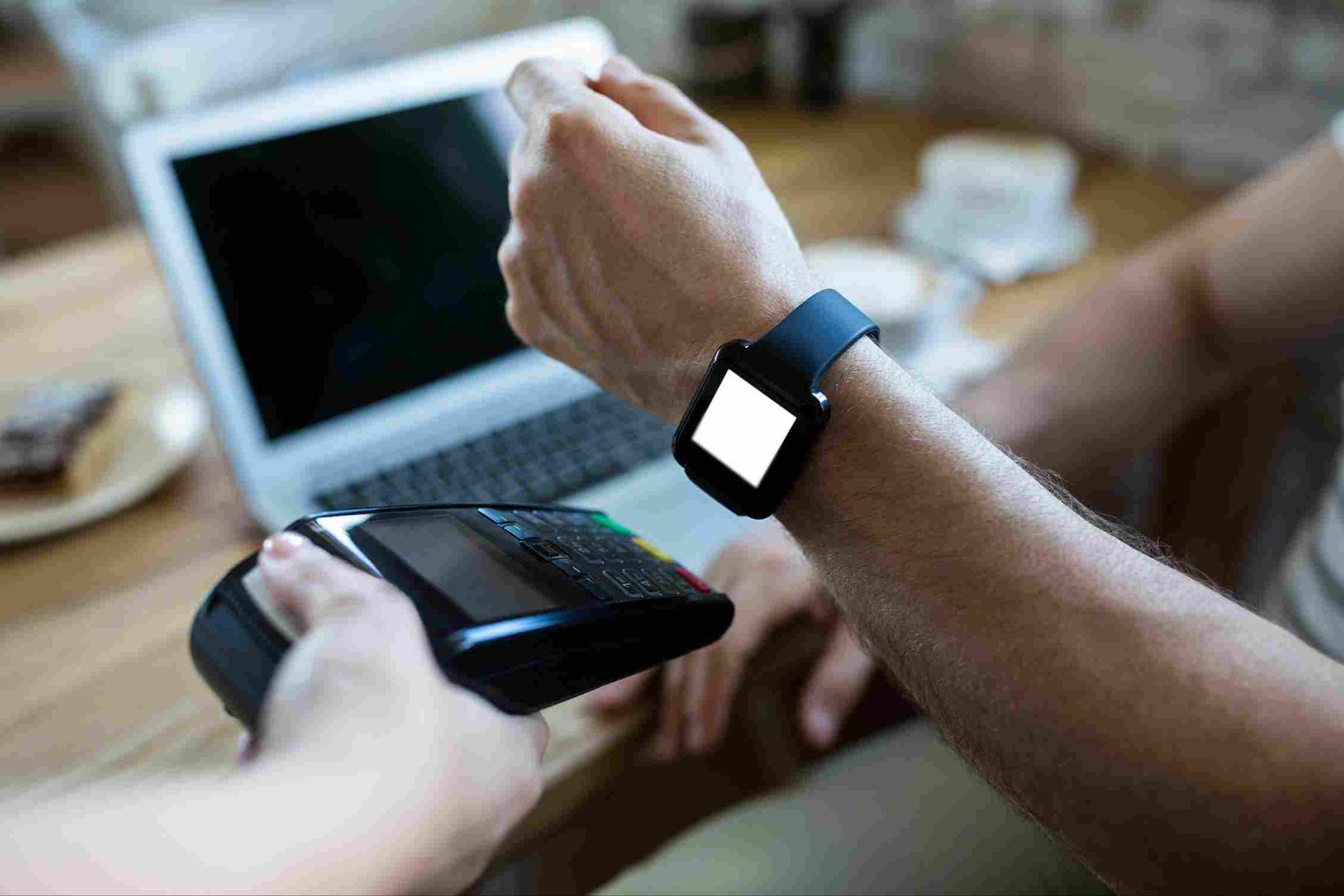 Employee clocking in using a smartwatch and mobile terminal