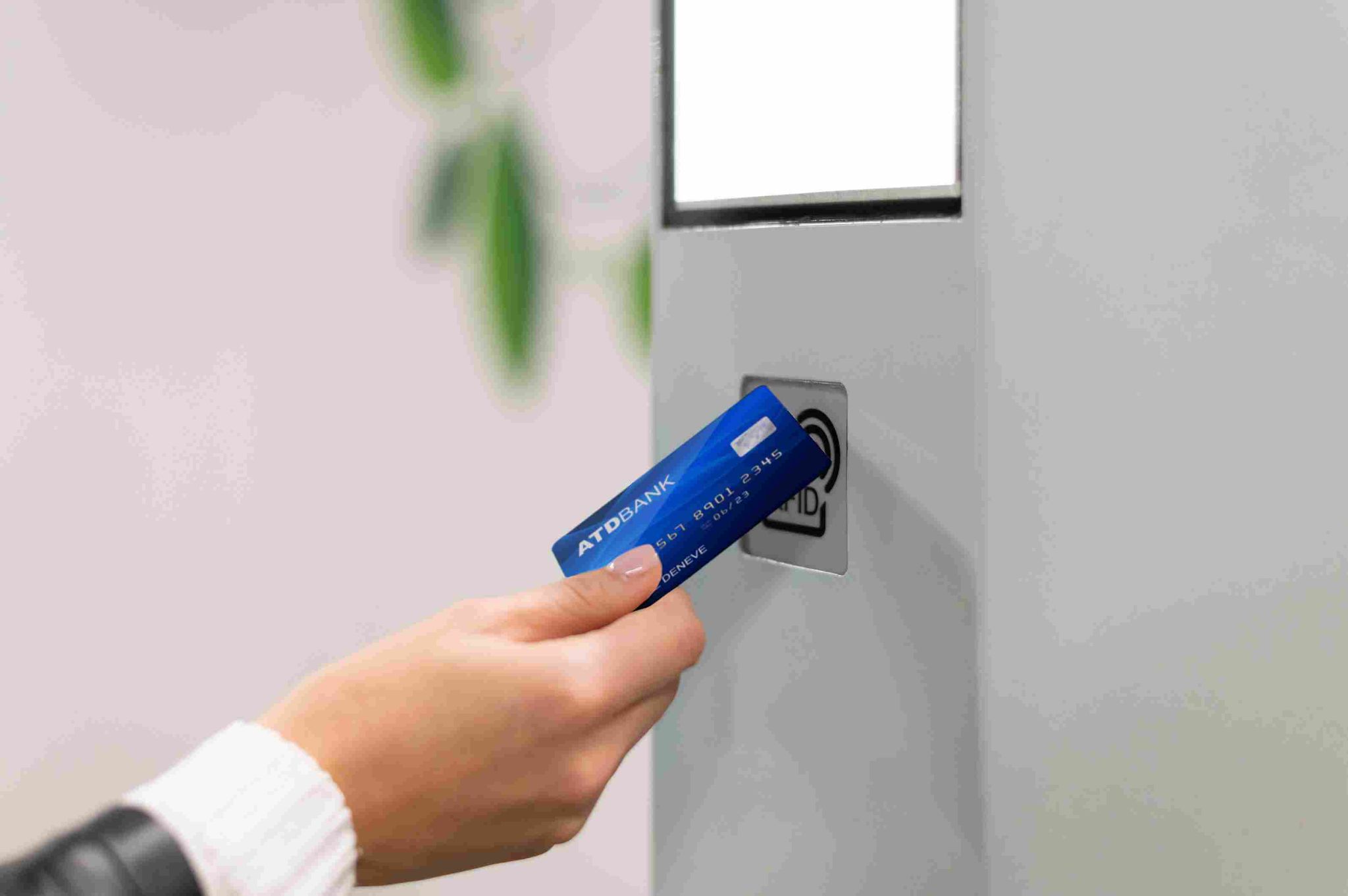 Employee swiping a blue card at a card reader