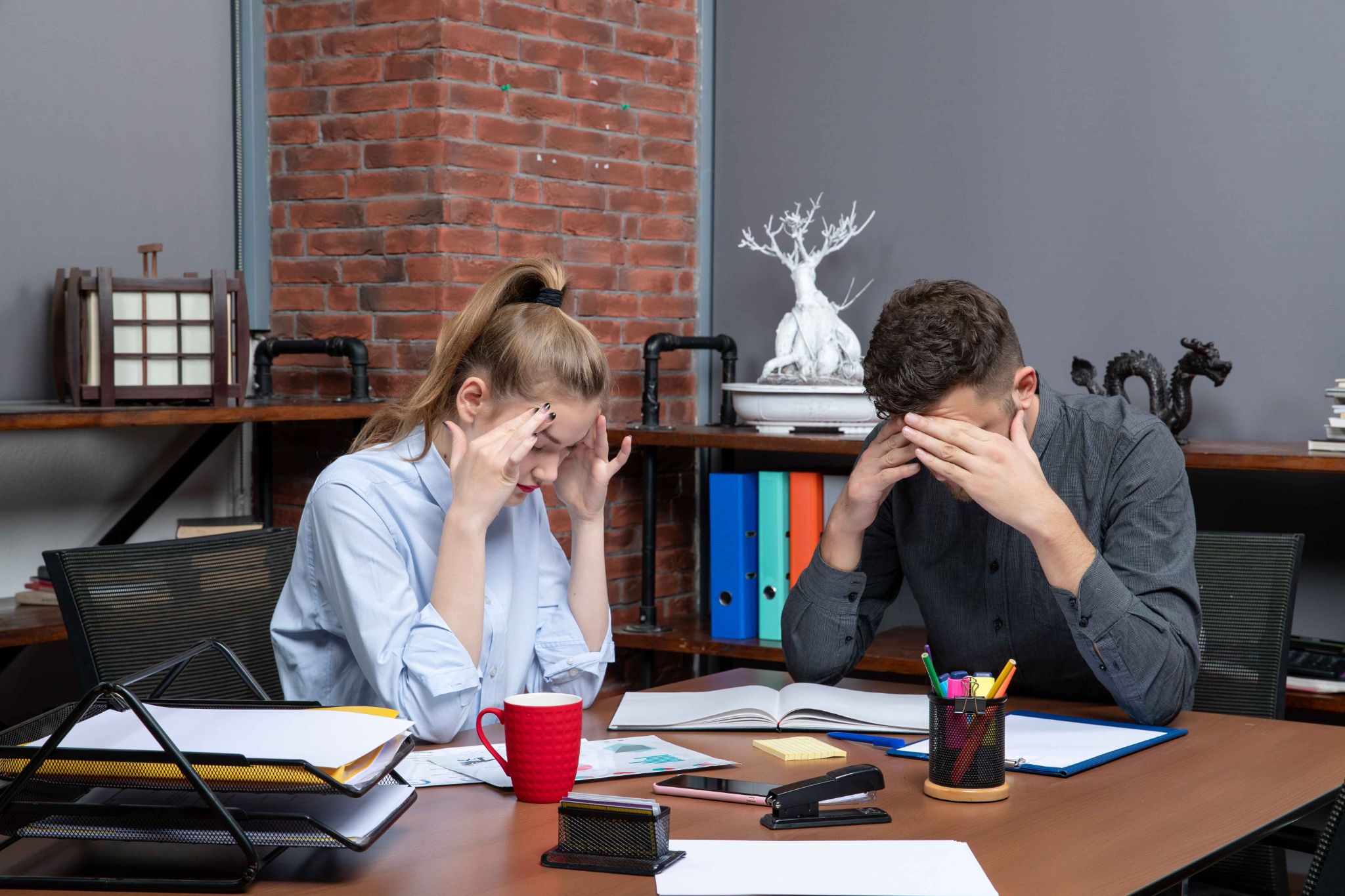 Stressed employees showing damage to workplace culture