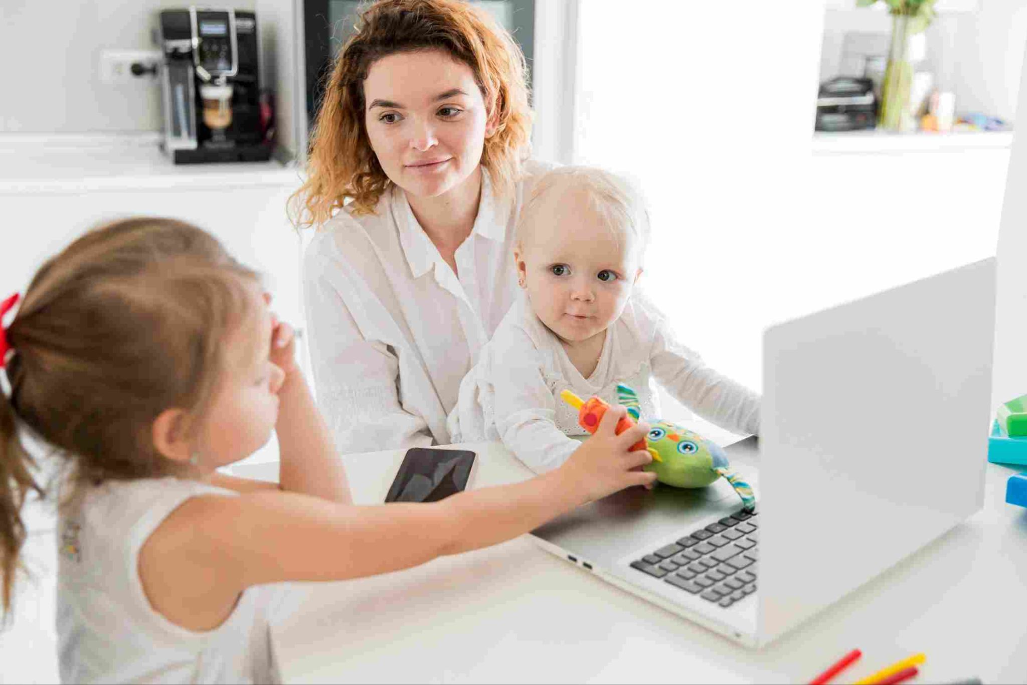 Woman showing a tablet to a toddler
