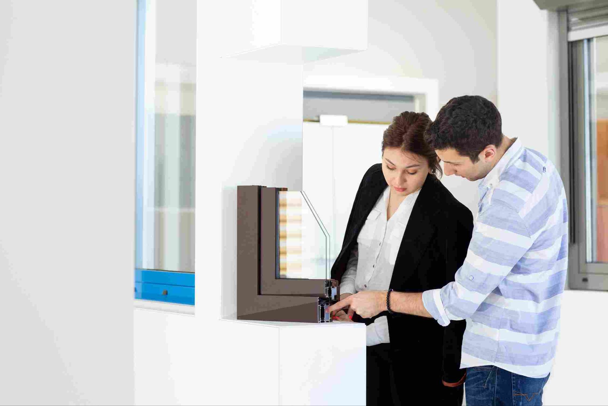 Two employees using a time clock kiosk