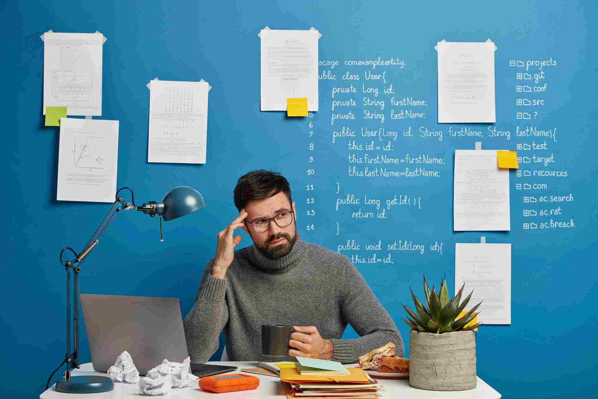 Man looking stressed at his desk