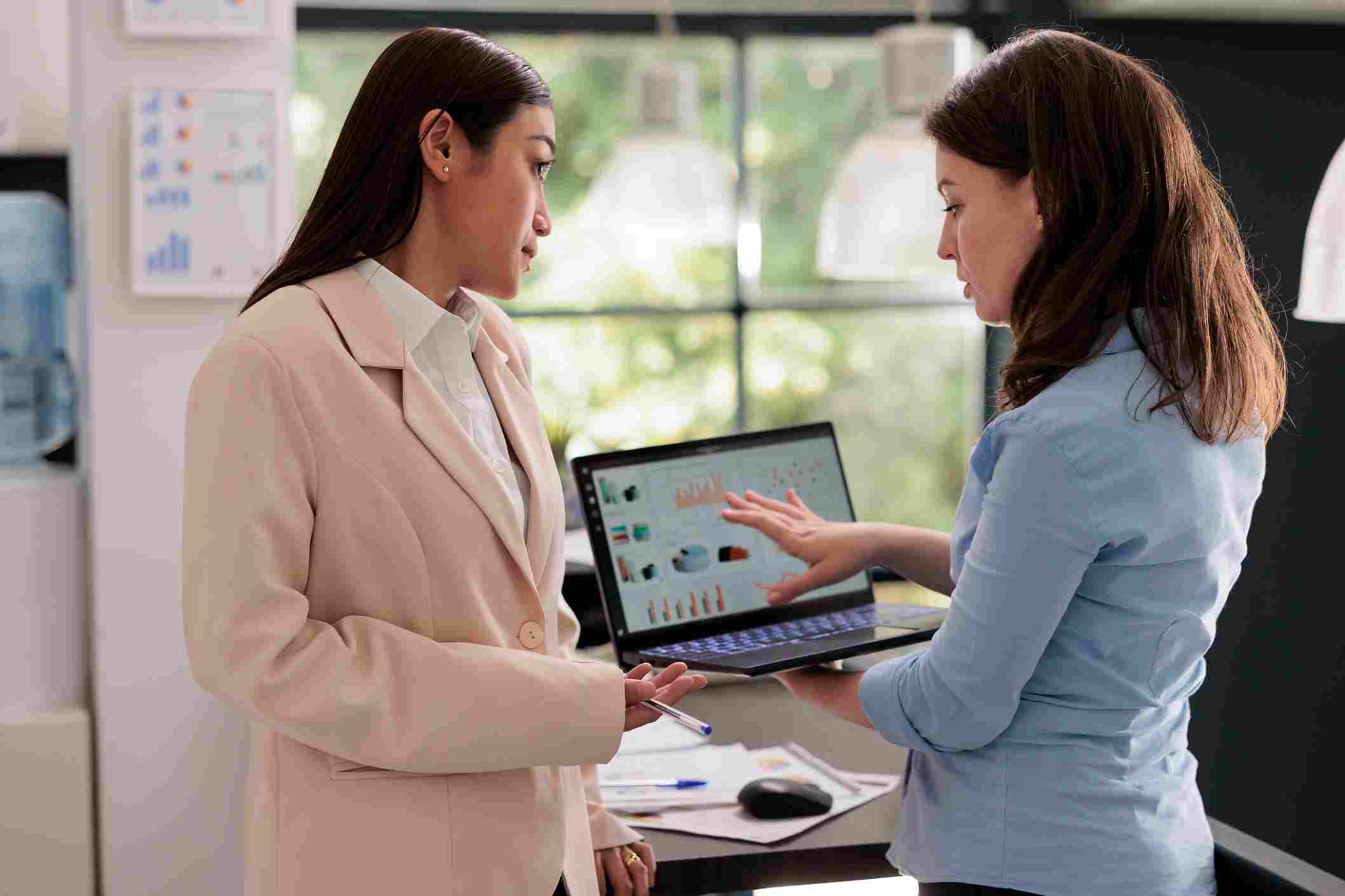 Two women looking at a tablet