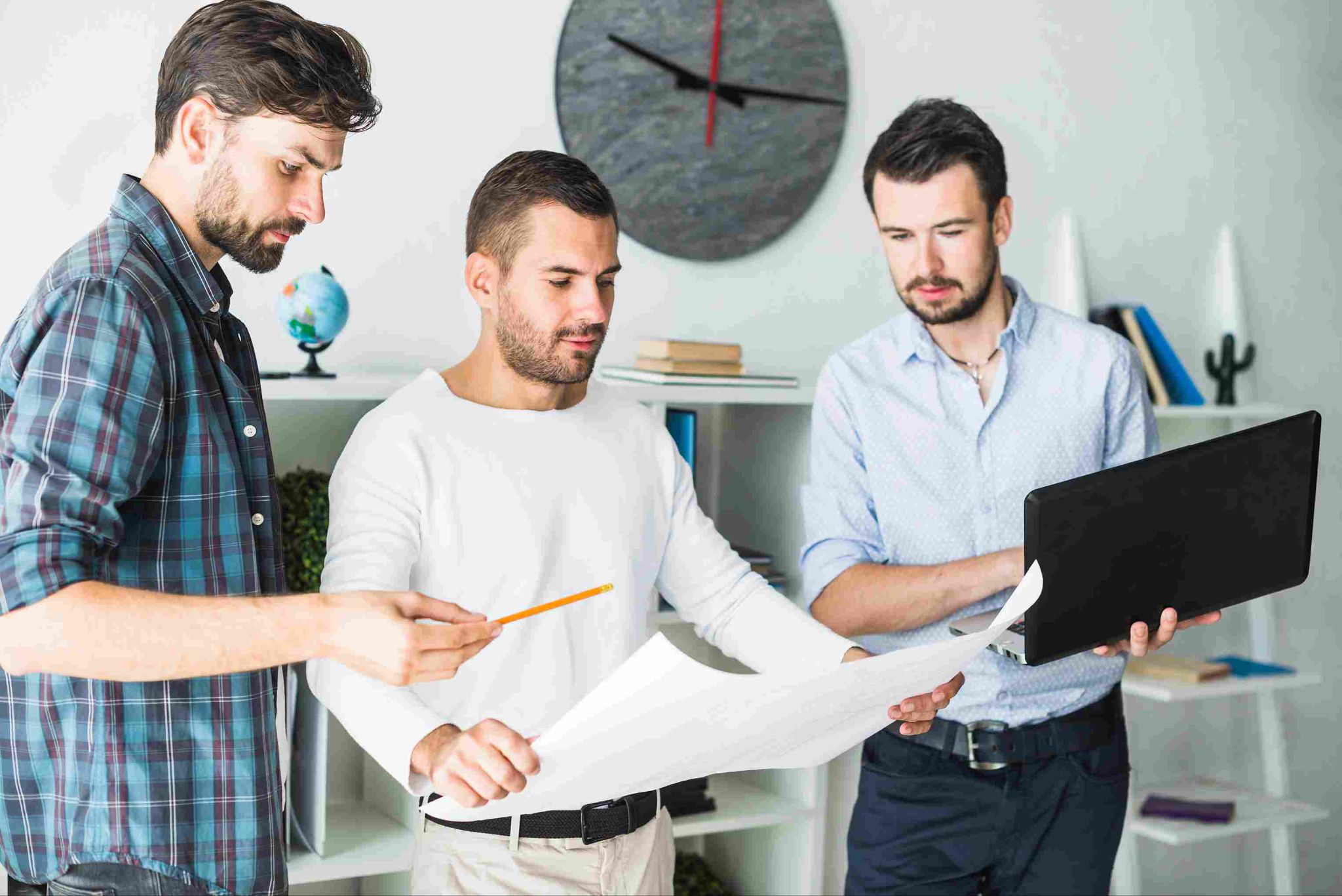 Construction team reviewing documents together in an office