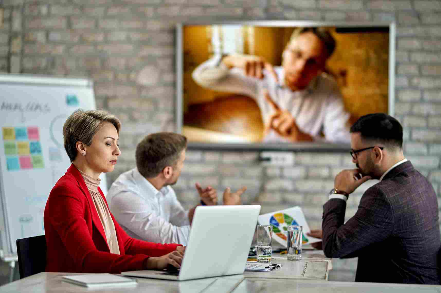 Team of employees meeting and discussing in an office
