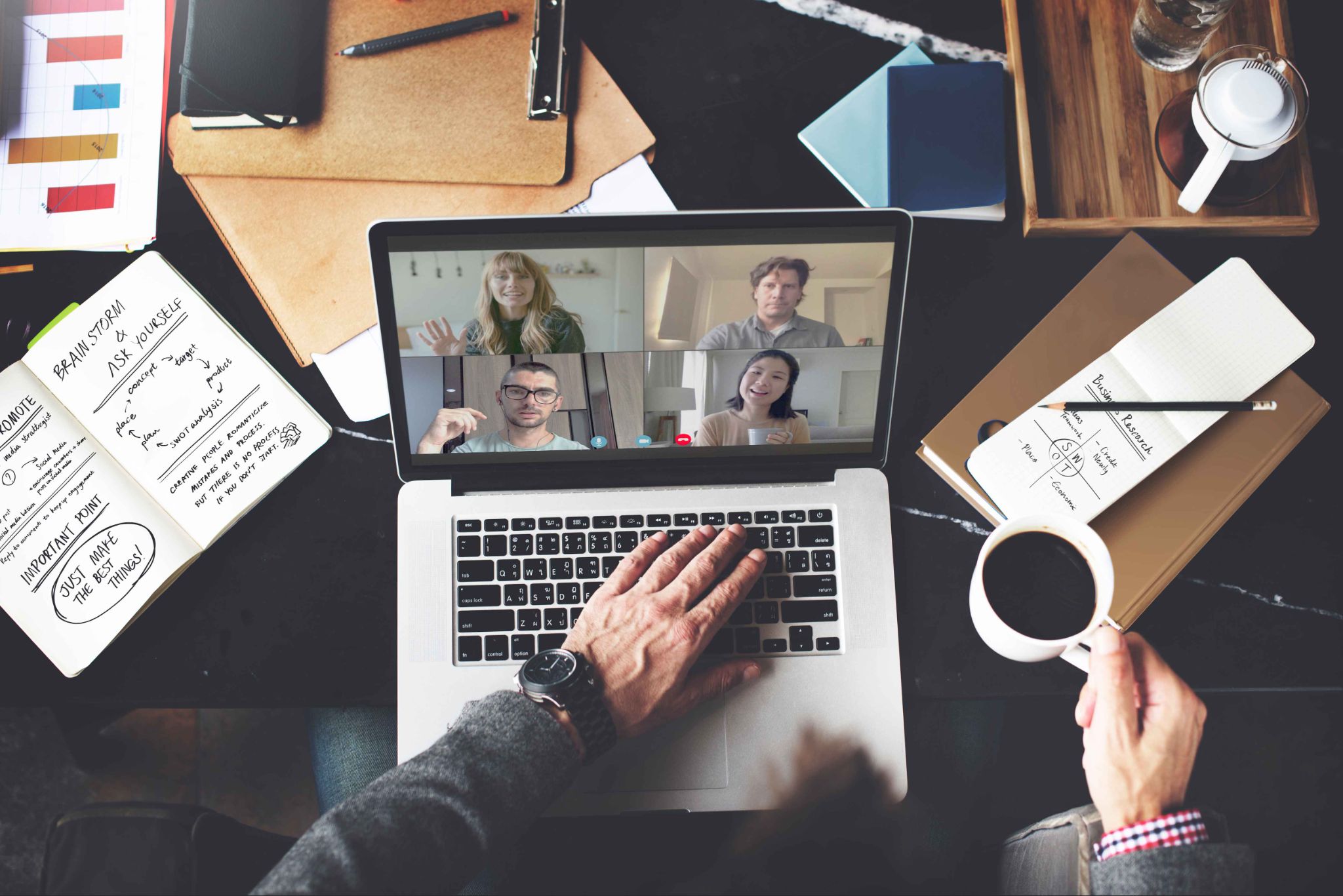 Remote team video meeting on a laptop for workforce management