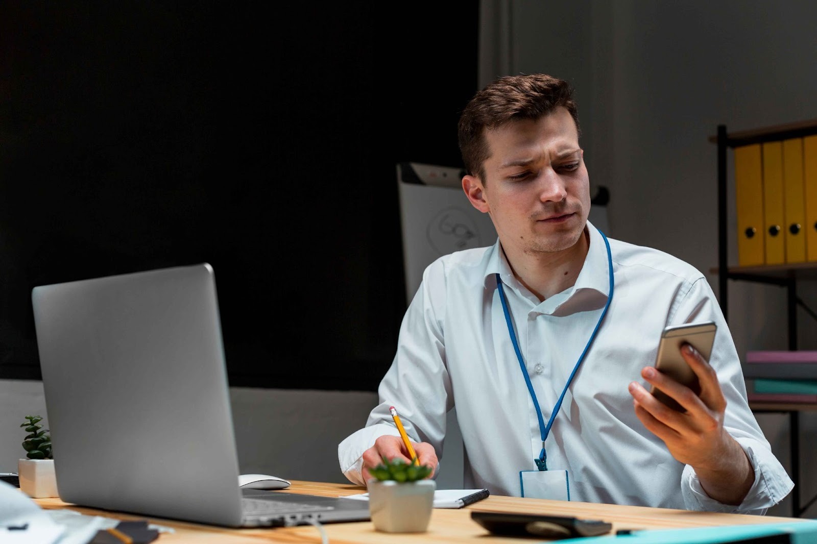 Employee checking messages on phone