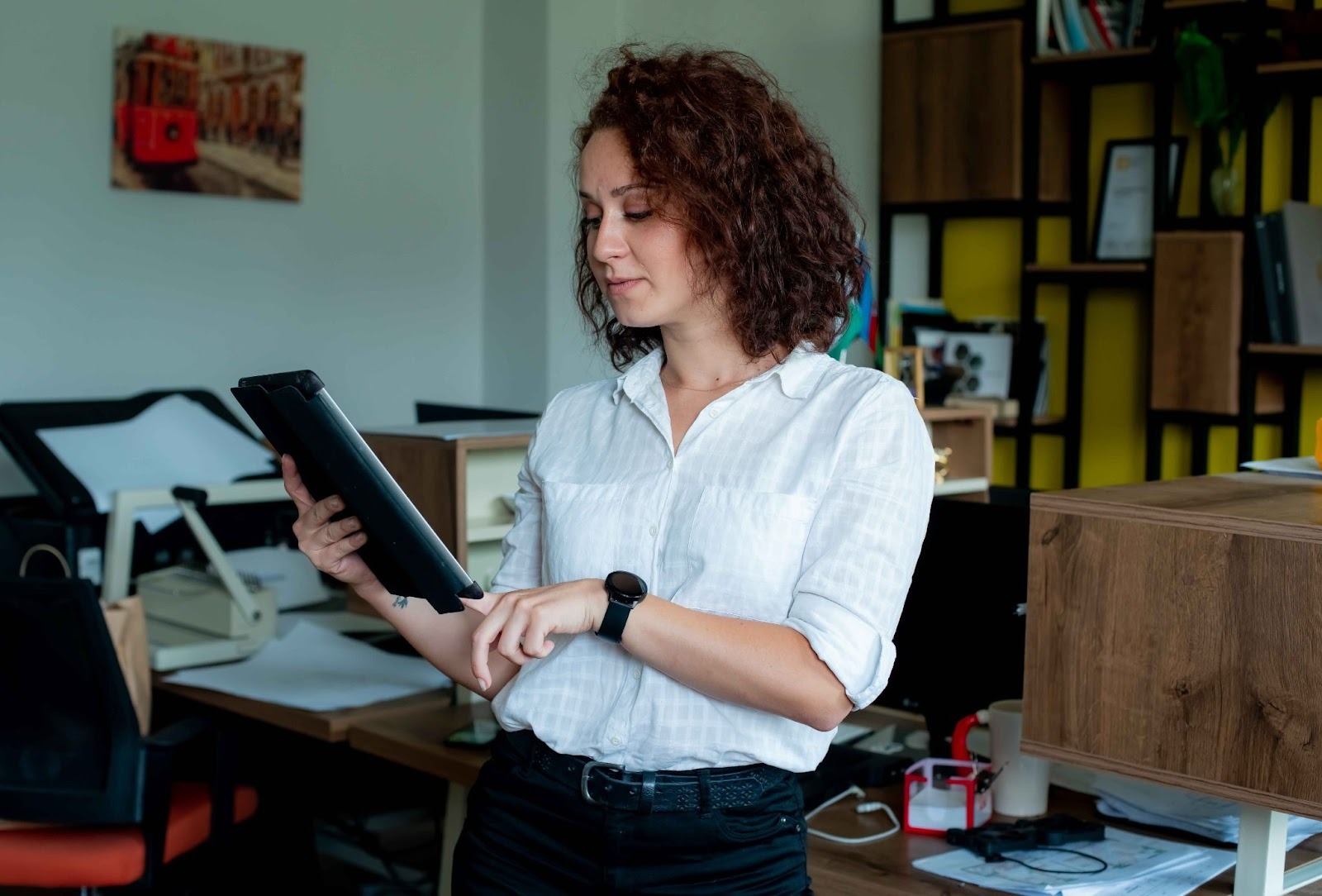 Woman holding a tablet in an office