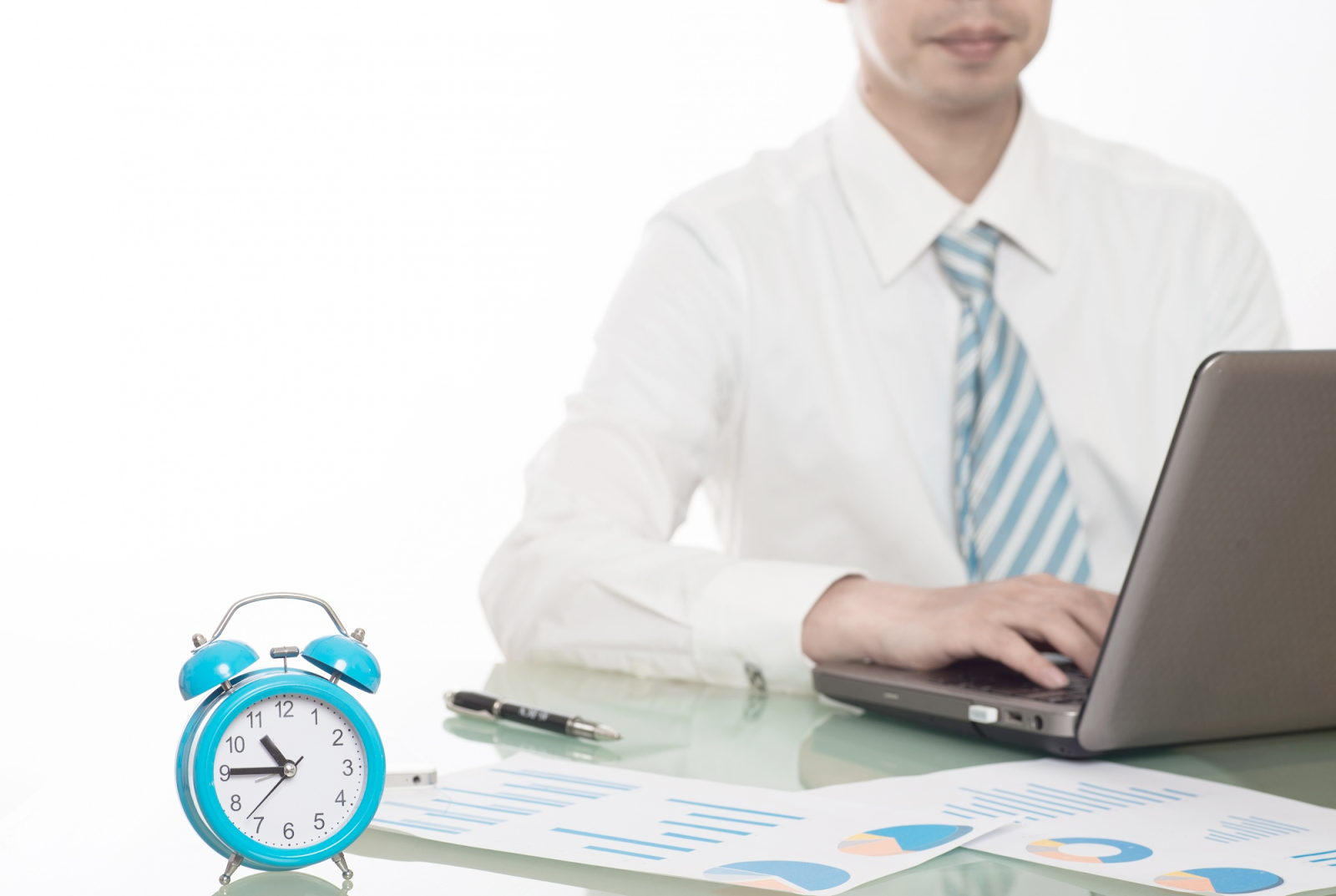 Business time tracking concept with clock, laptop, and reports