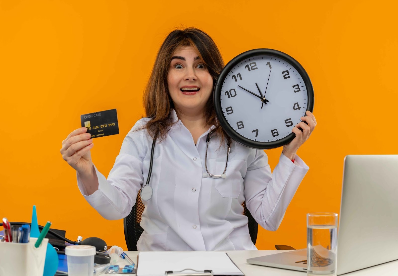 Woman holding a clock and credit card