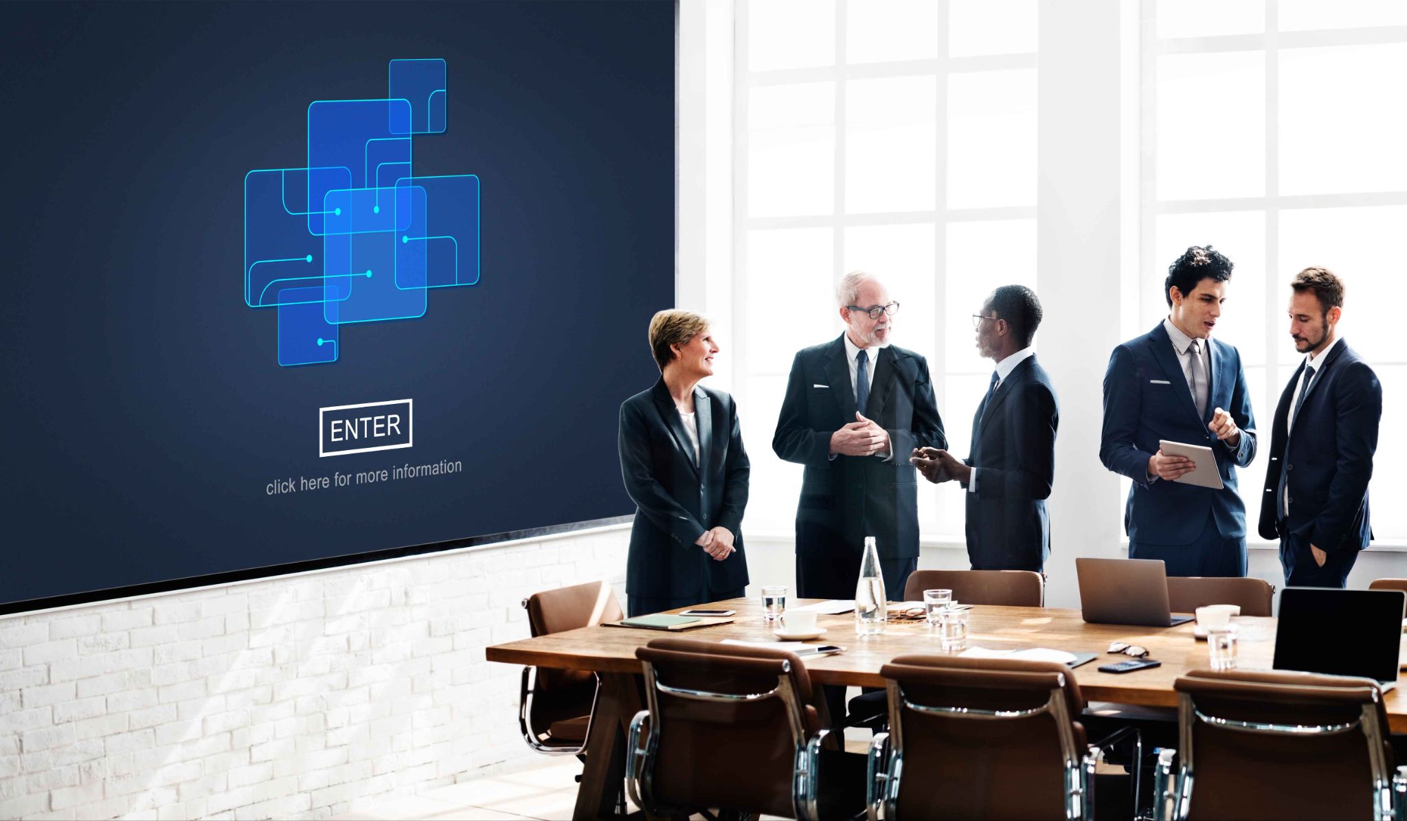 Group of business people looking at a presentation screen