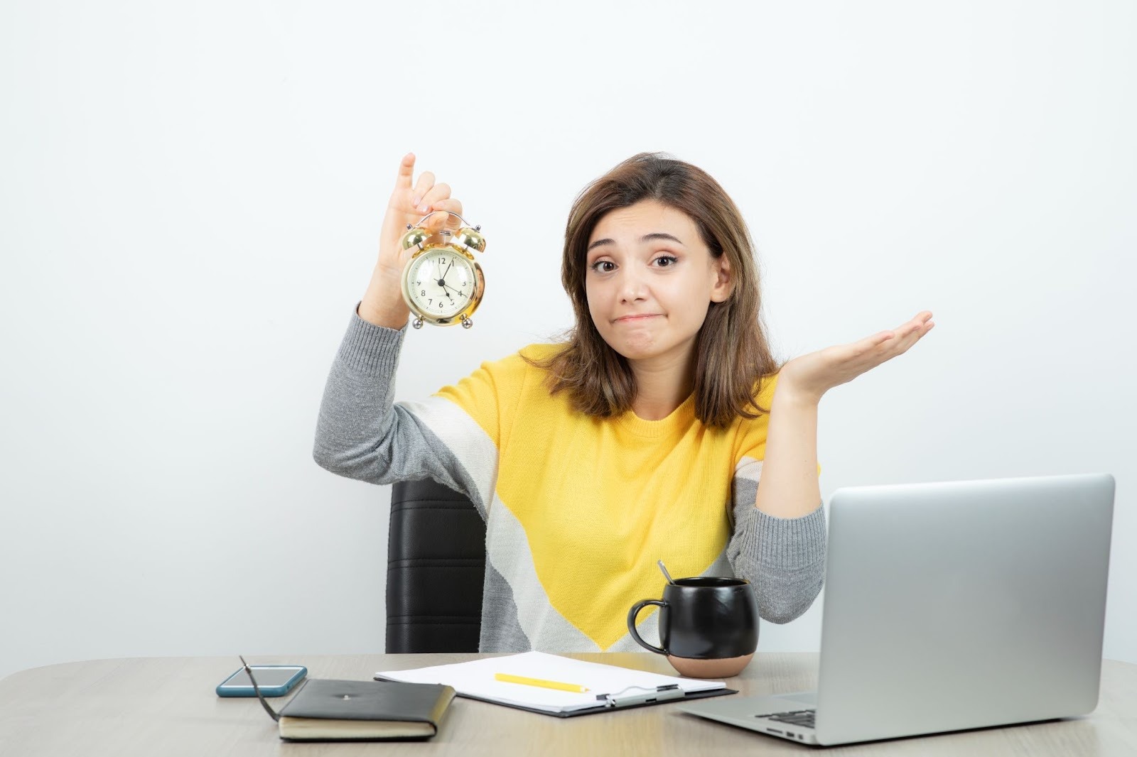 Woman holding a clock looking confused about travel time pay