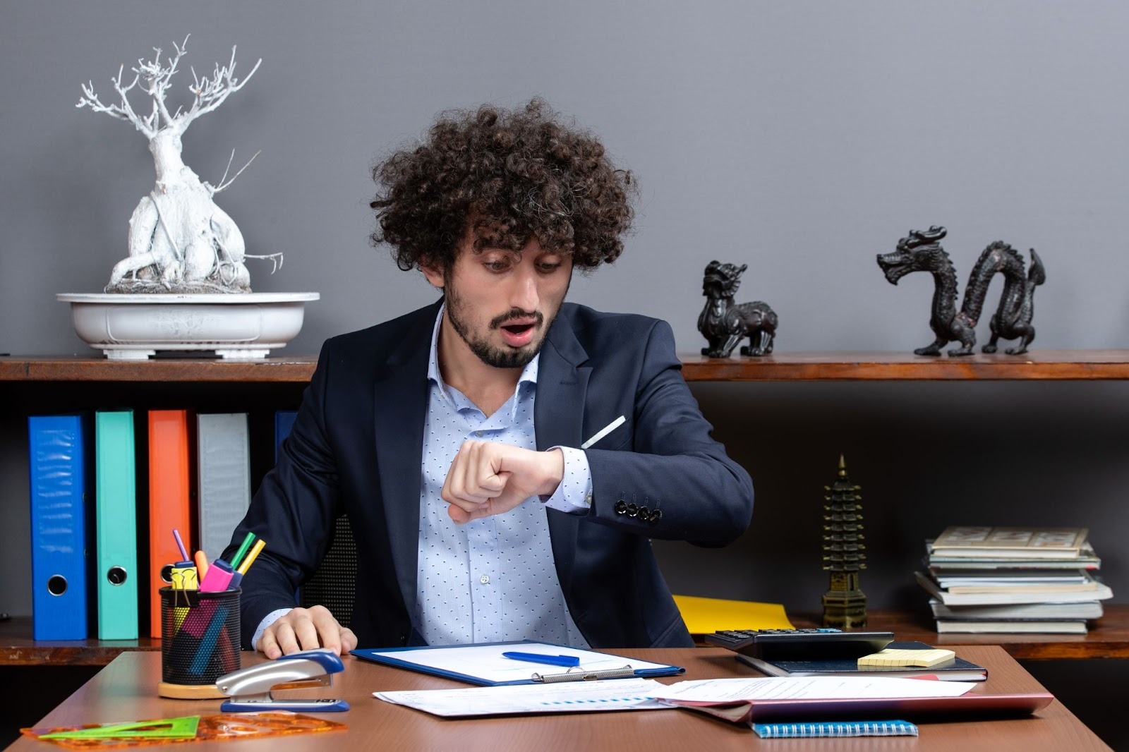 Man looking shocked at his watch tracking travel time