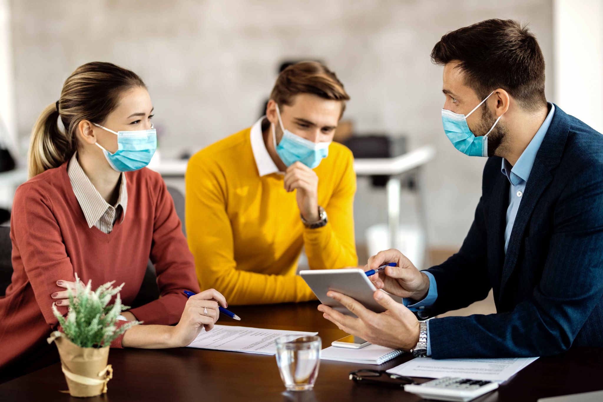 Healthcare professionals discussing secure data and time clock compliance