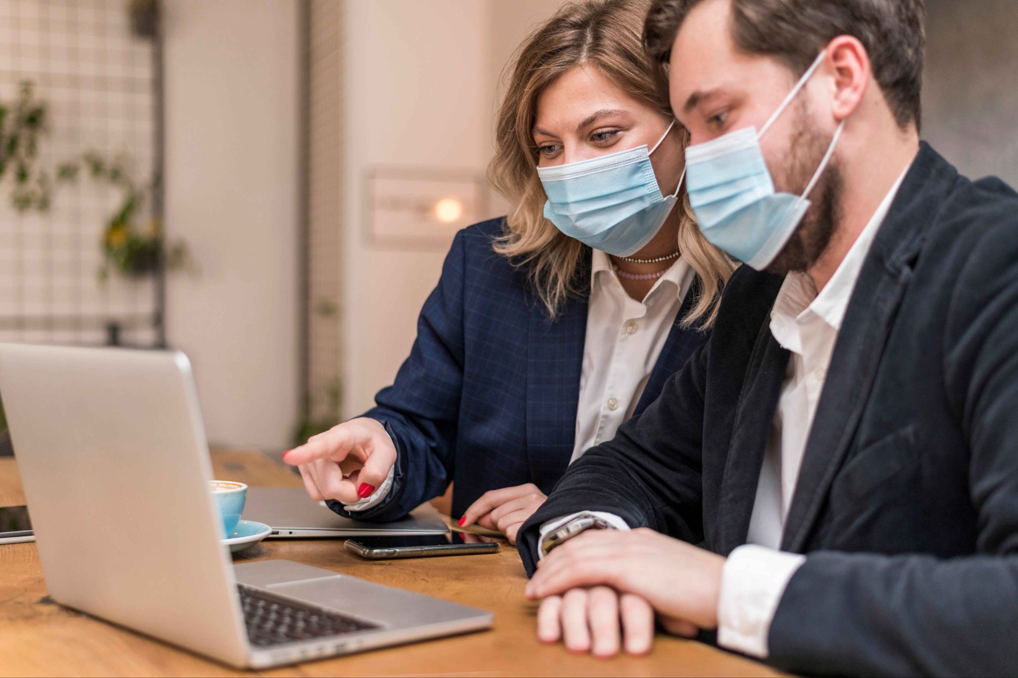 Healthcare managers reviewing staff scheduling and attendance compliance