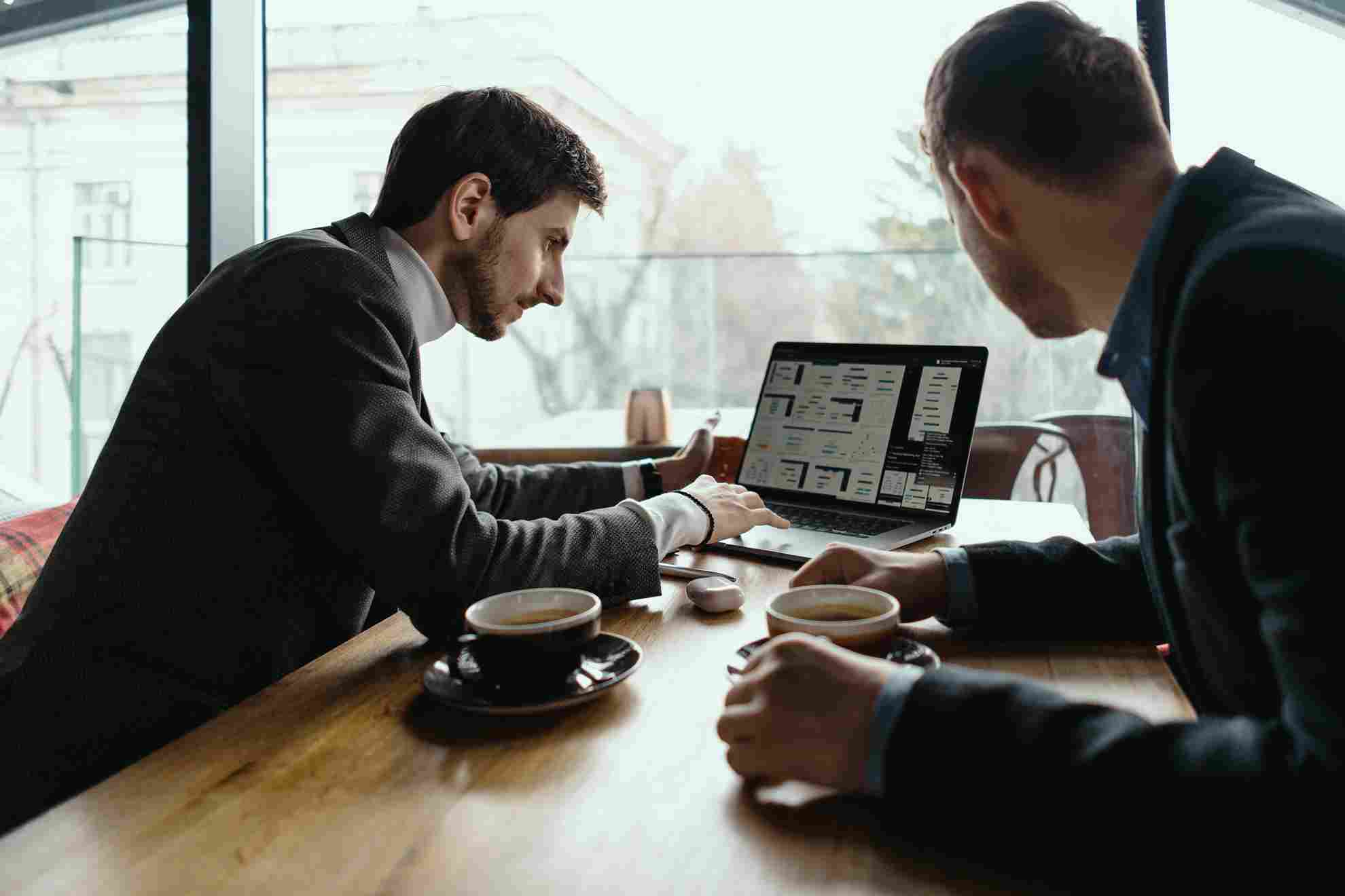 Business professionals reviewing software choices