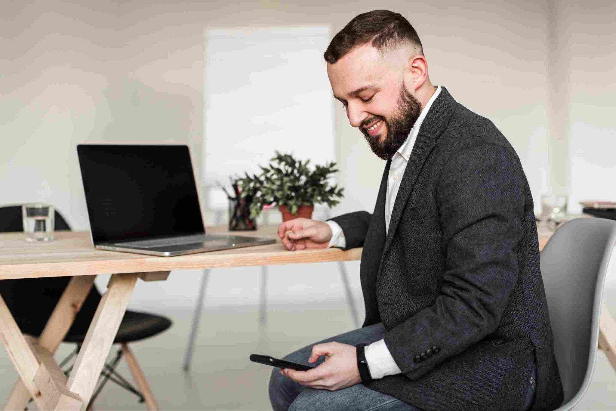 Man sitting and using his smartphone