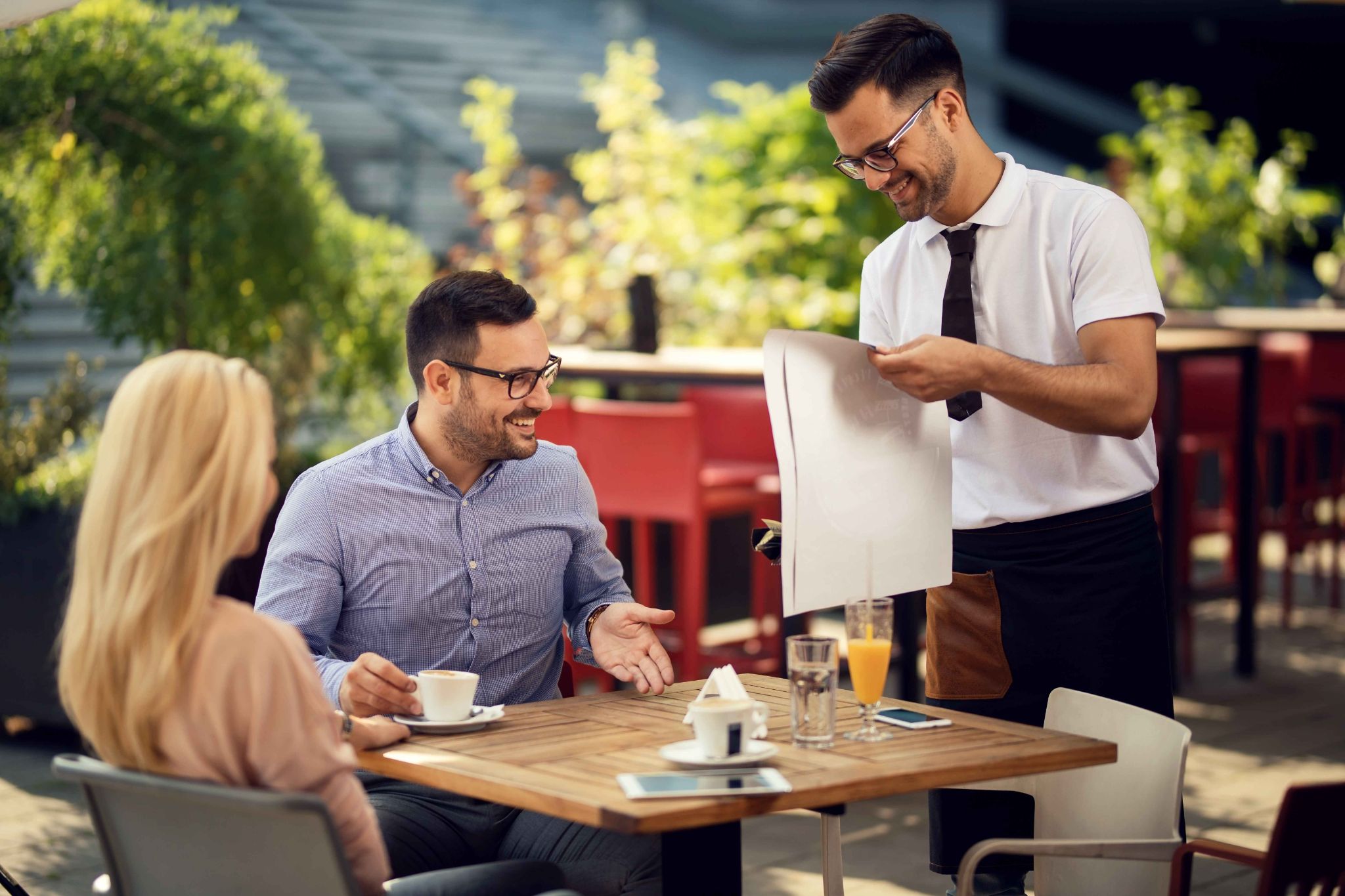 Manager and employees reviewing schedules together