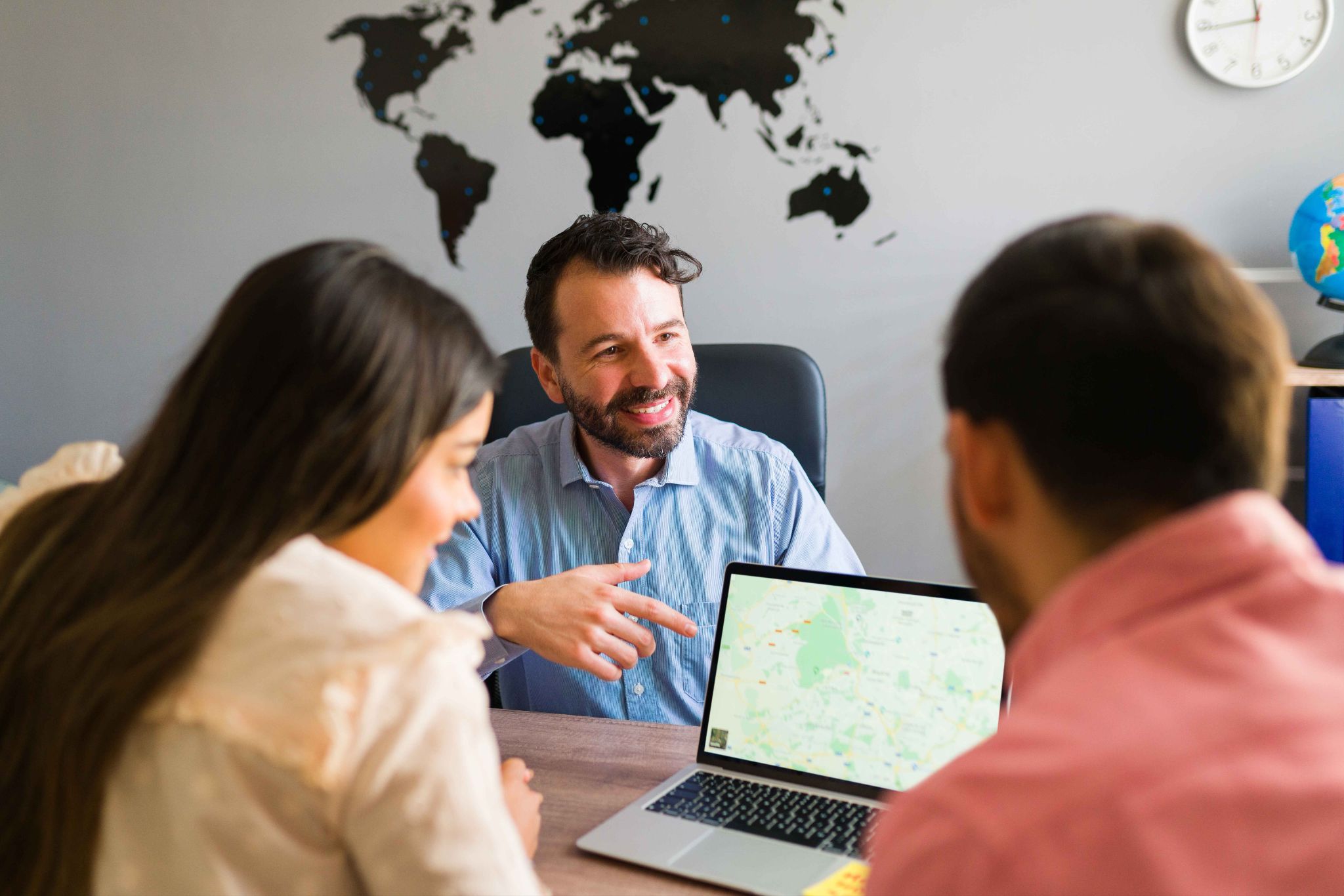 Manager reviewing geofence locations on a laptop