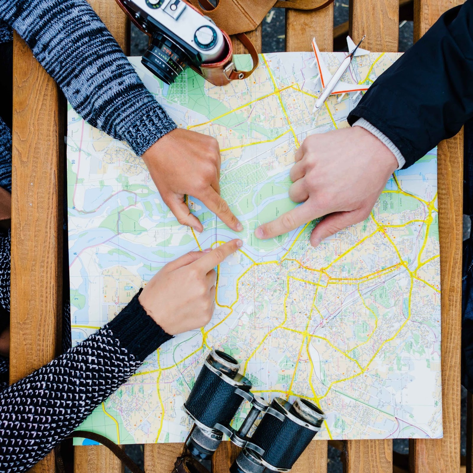 People pointing at a map
