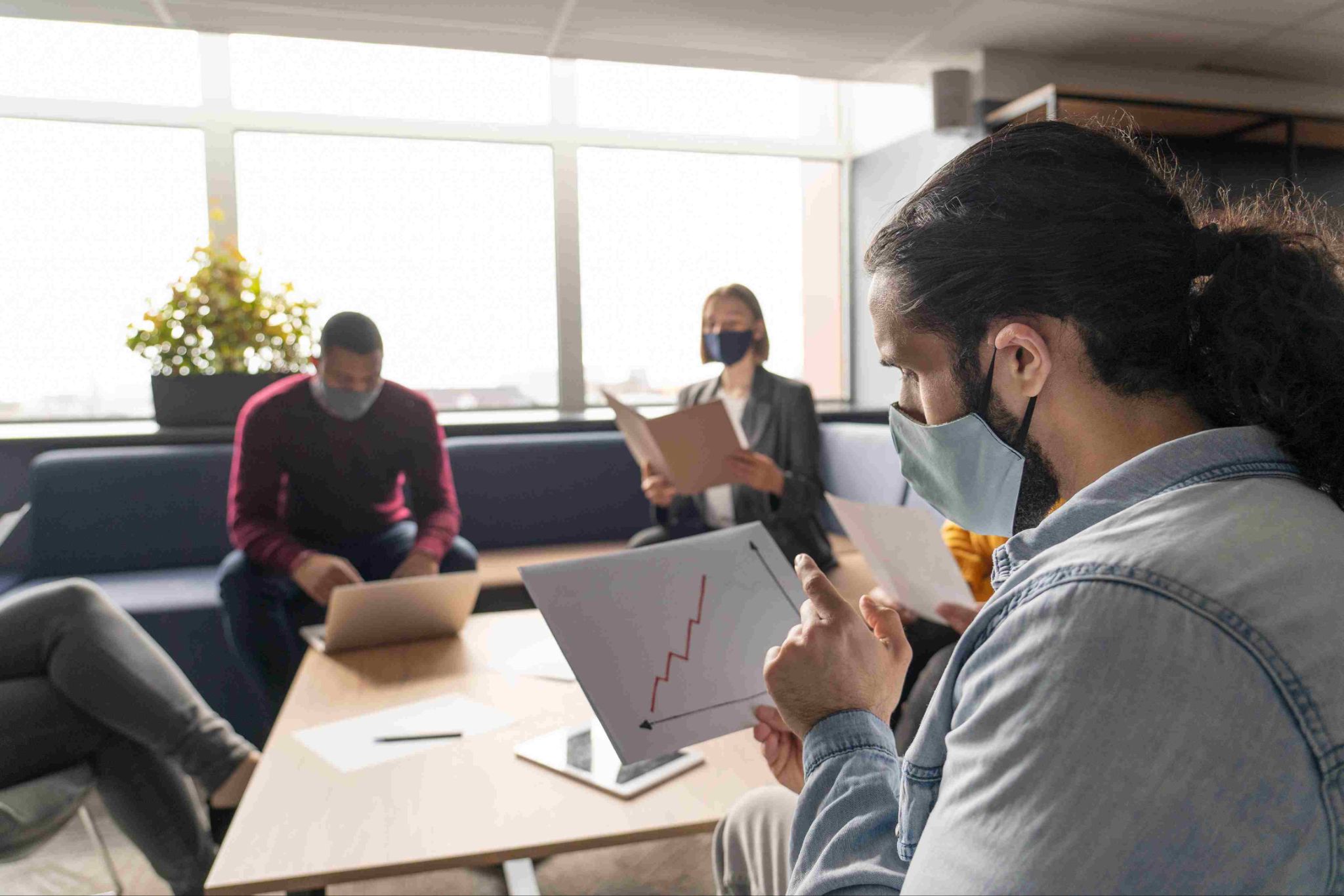 Team meeting with charts