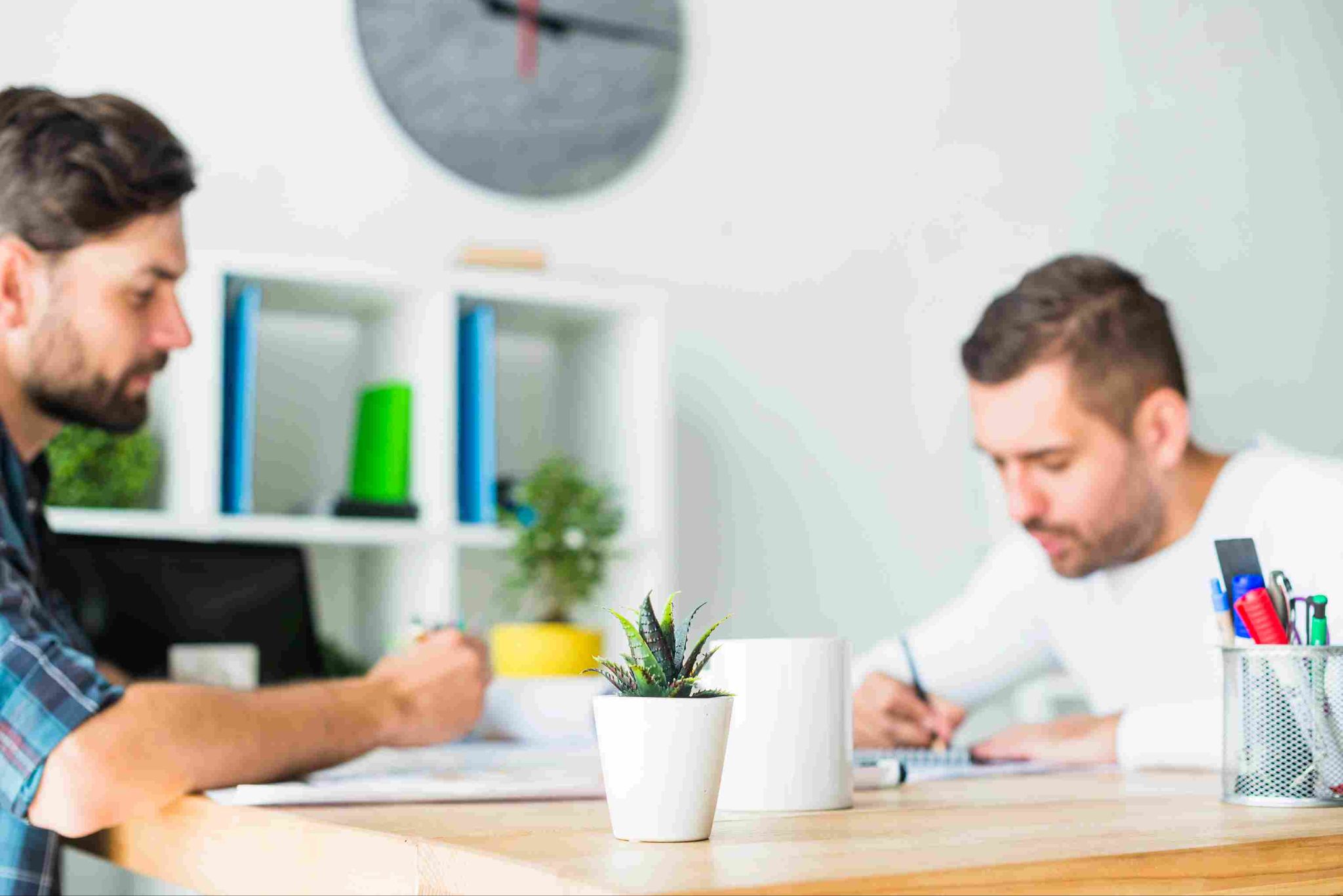 Two men working at a desk