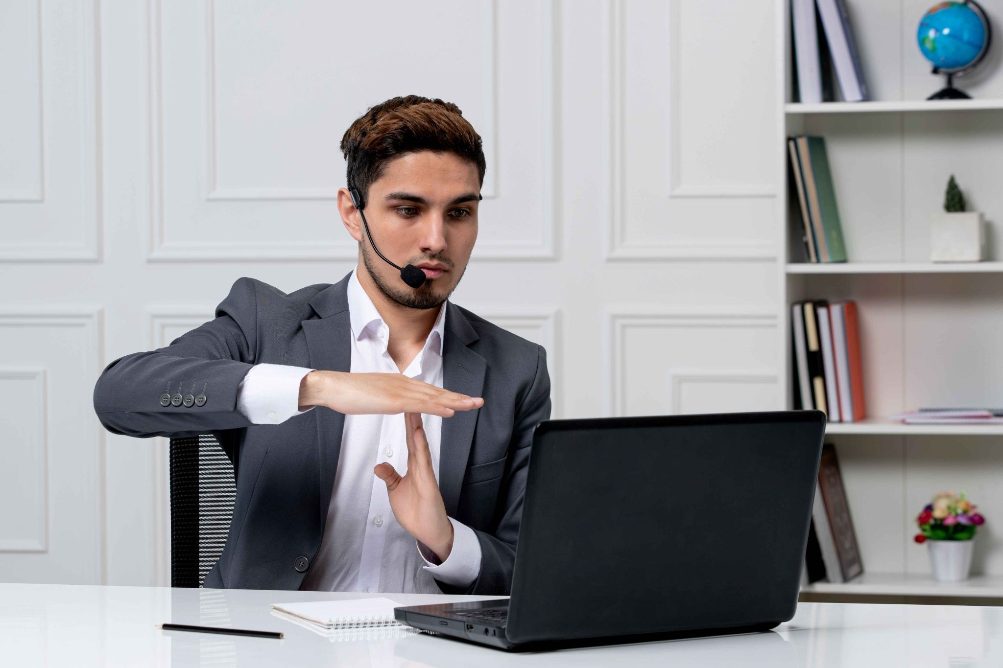 Businessman using an online hour counter on a laptop