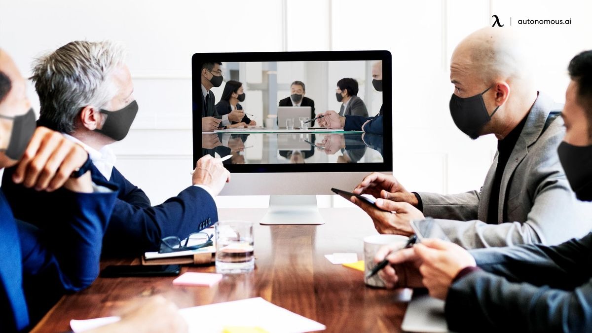 People in a meeting room having a video conference