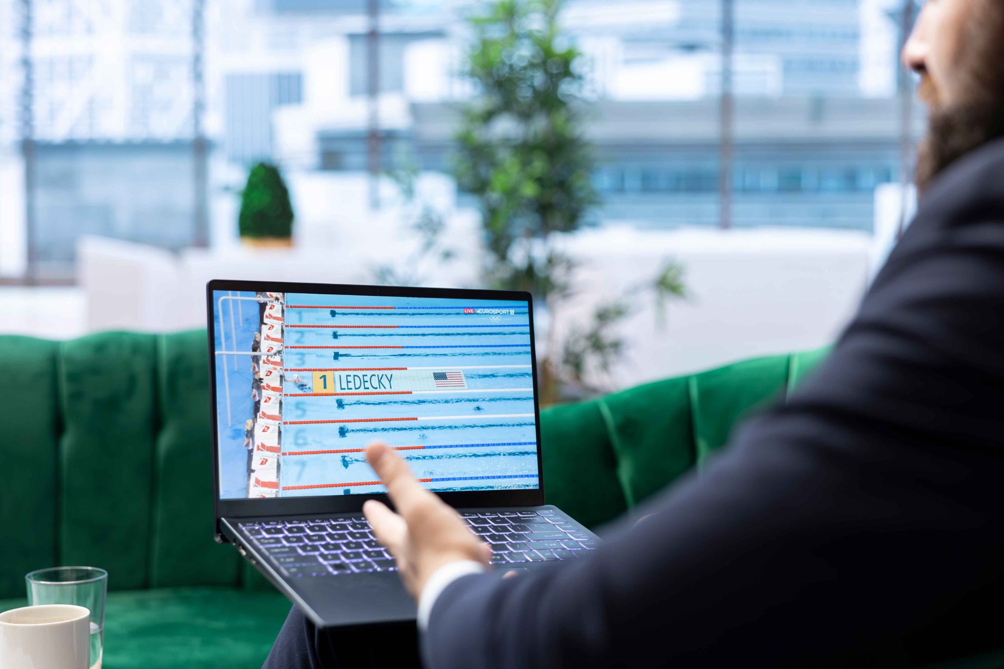 Manager Checking Schedule on Laptop