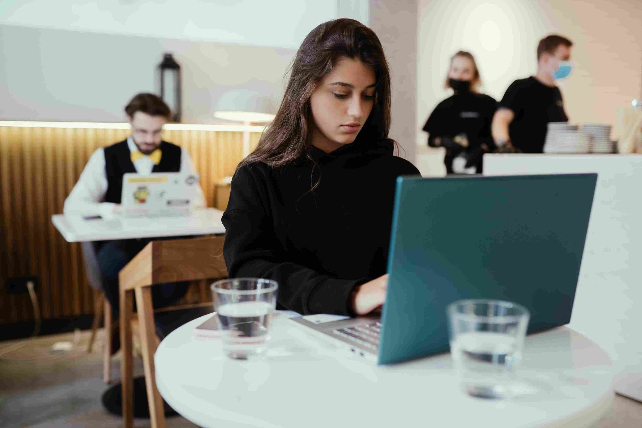 Woman looking at a laptop in a modern office