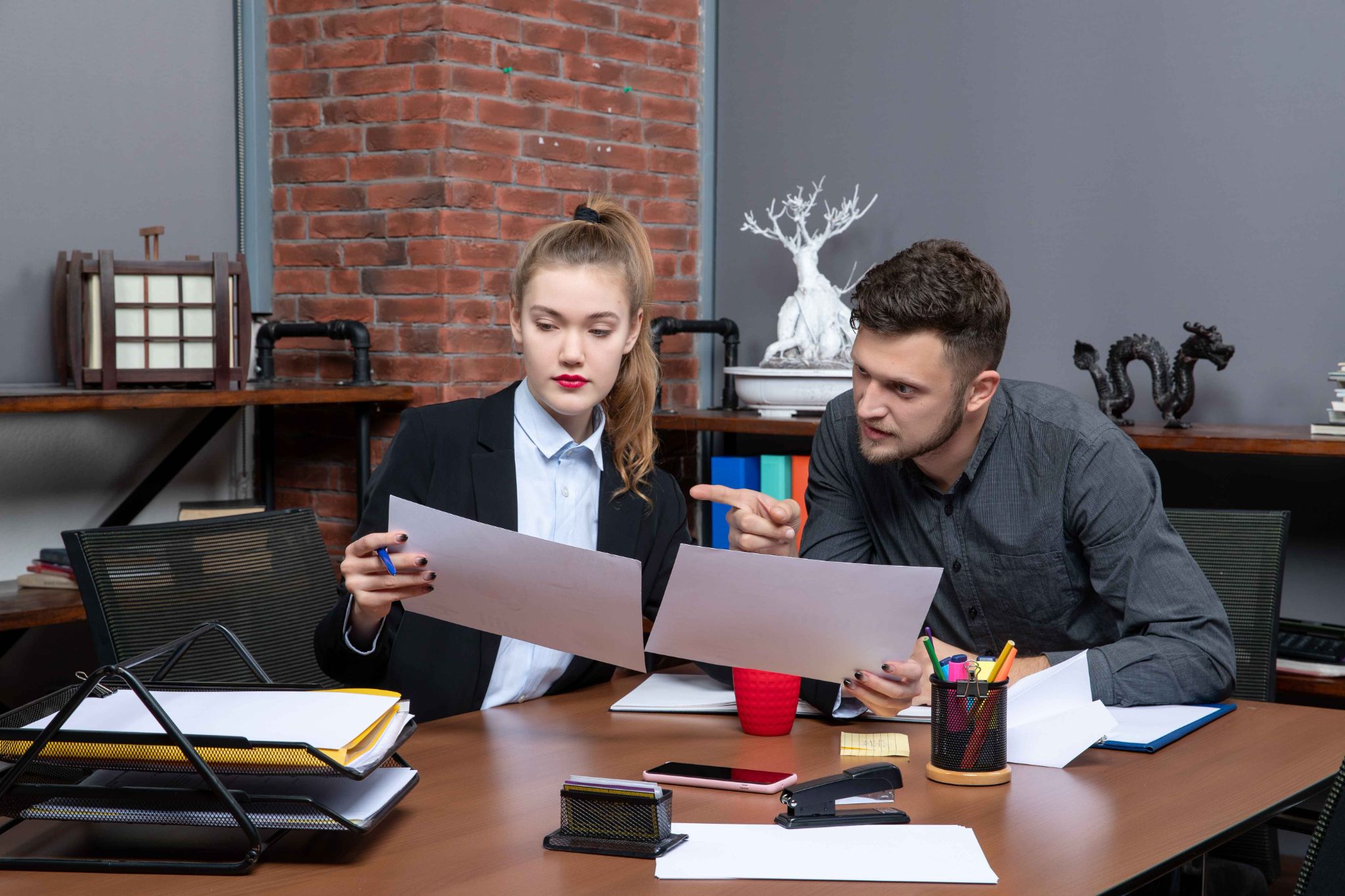 Legal professionals discussing documents in a law office