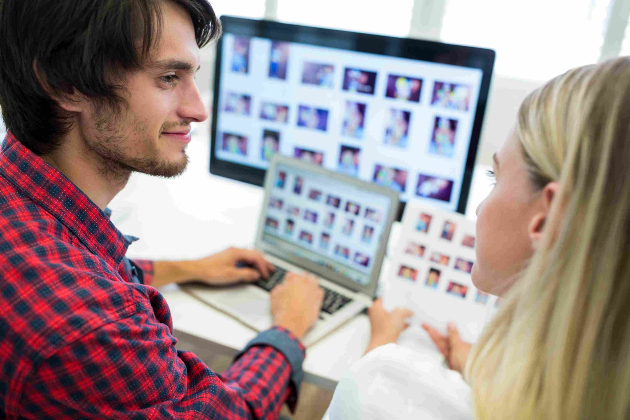 Two people looking at a computer screen