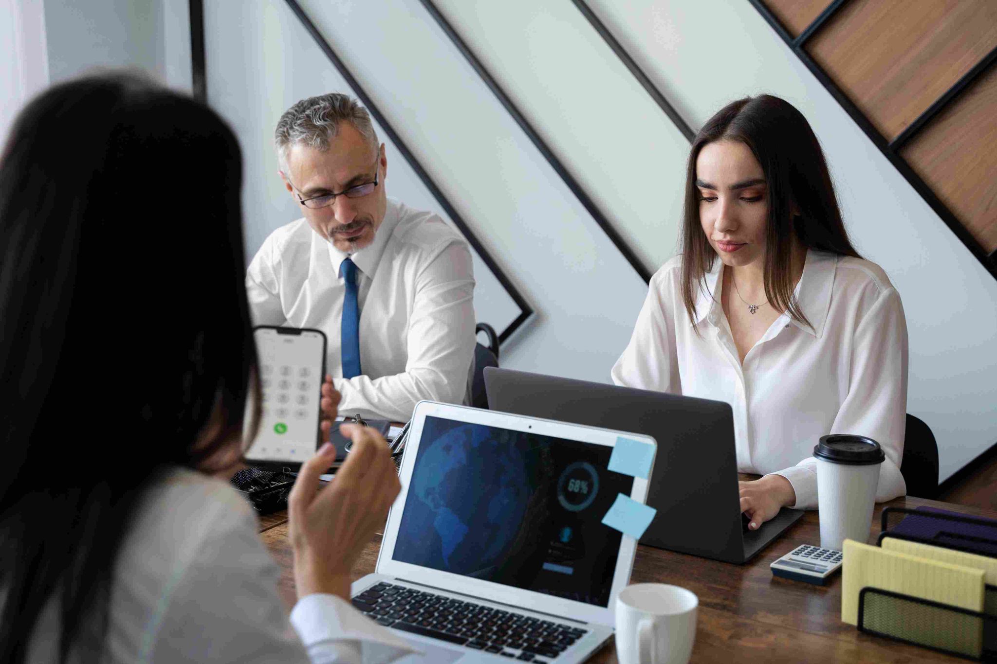 Three people meeting in an office