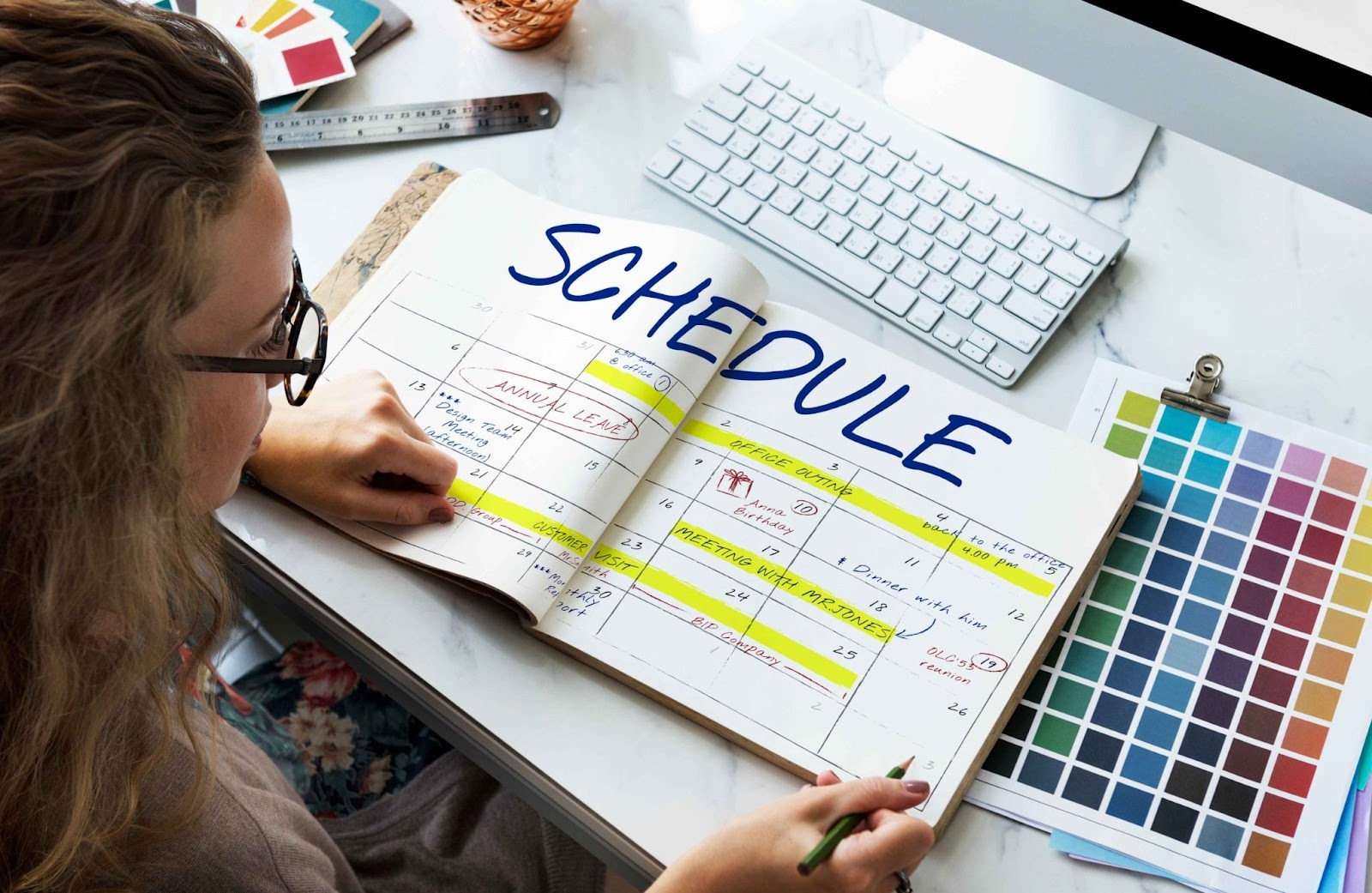 Person writing a schedule