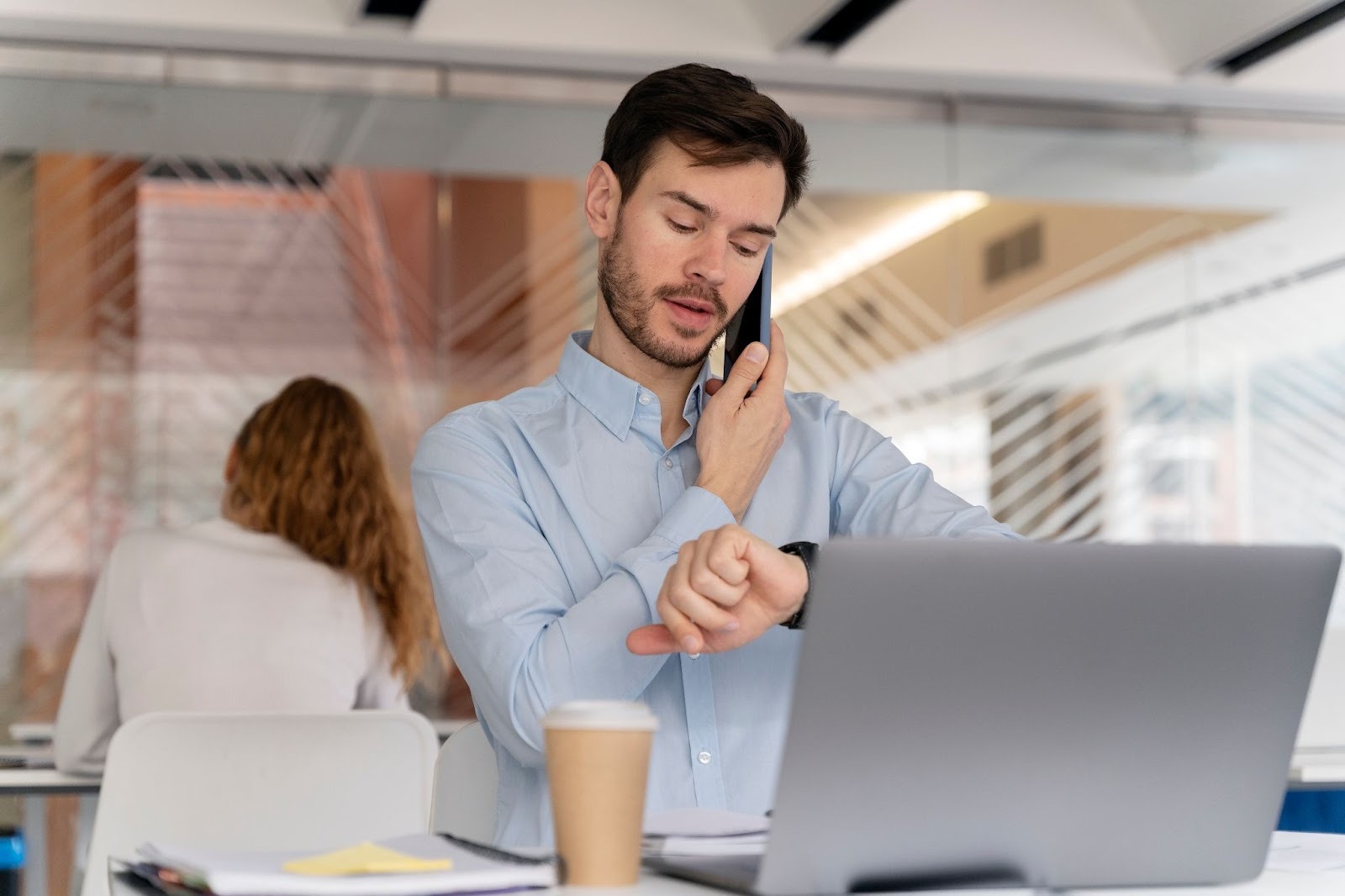 Man checking his watch on the phone