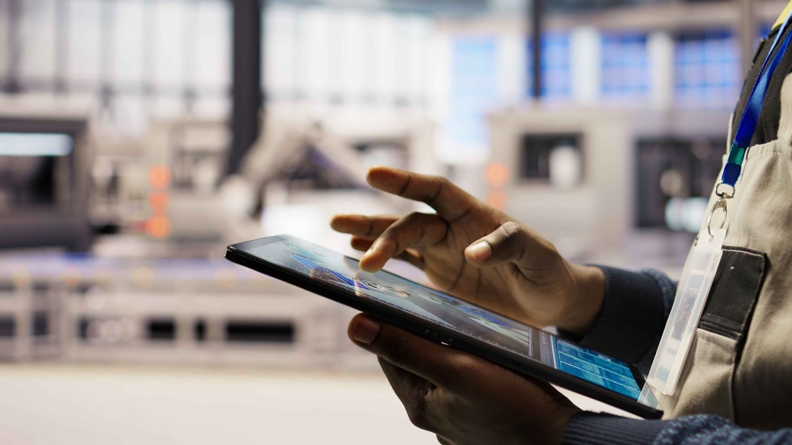 Manufacturing worker using a tablet on the production floor