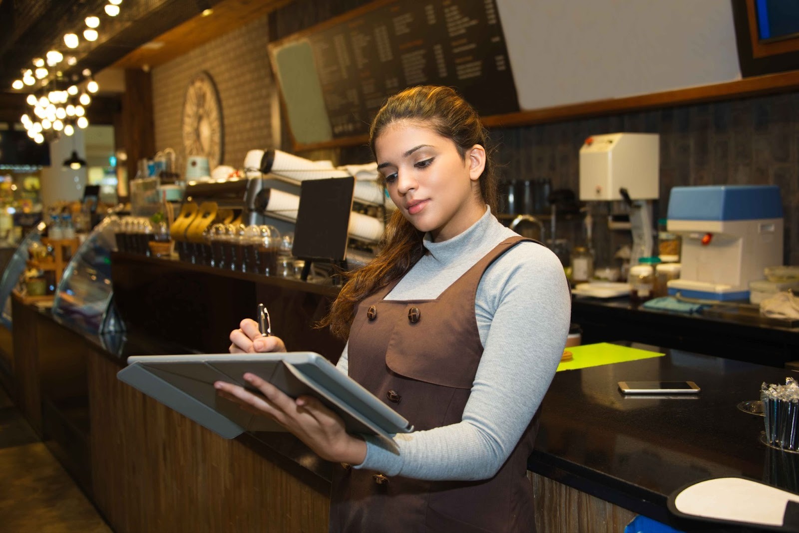 Restaurant staff using tablet