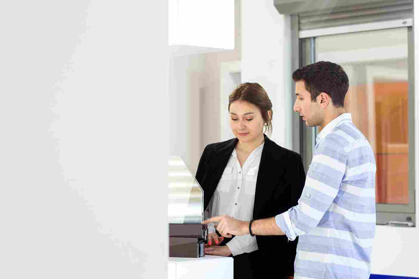 Man and woman discussing something in an office