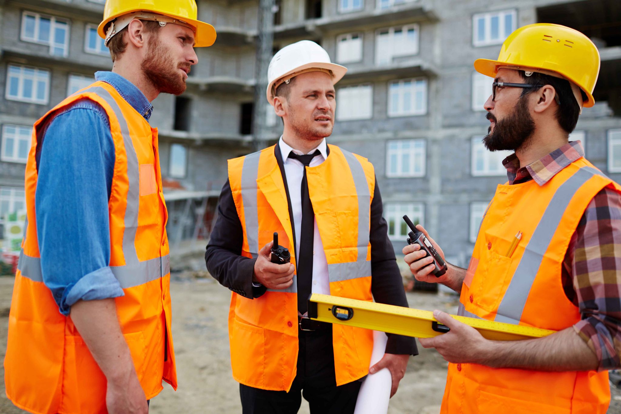 Construction and field team using mobile time tracking at job site